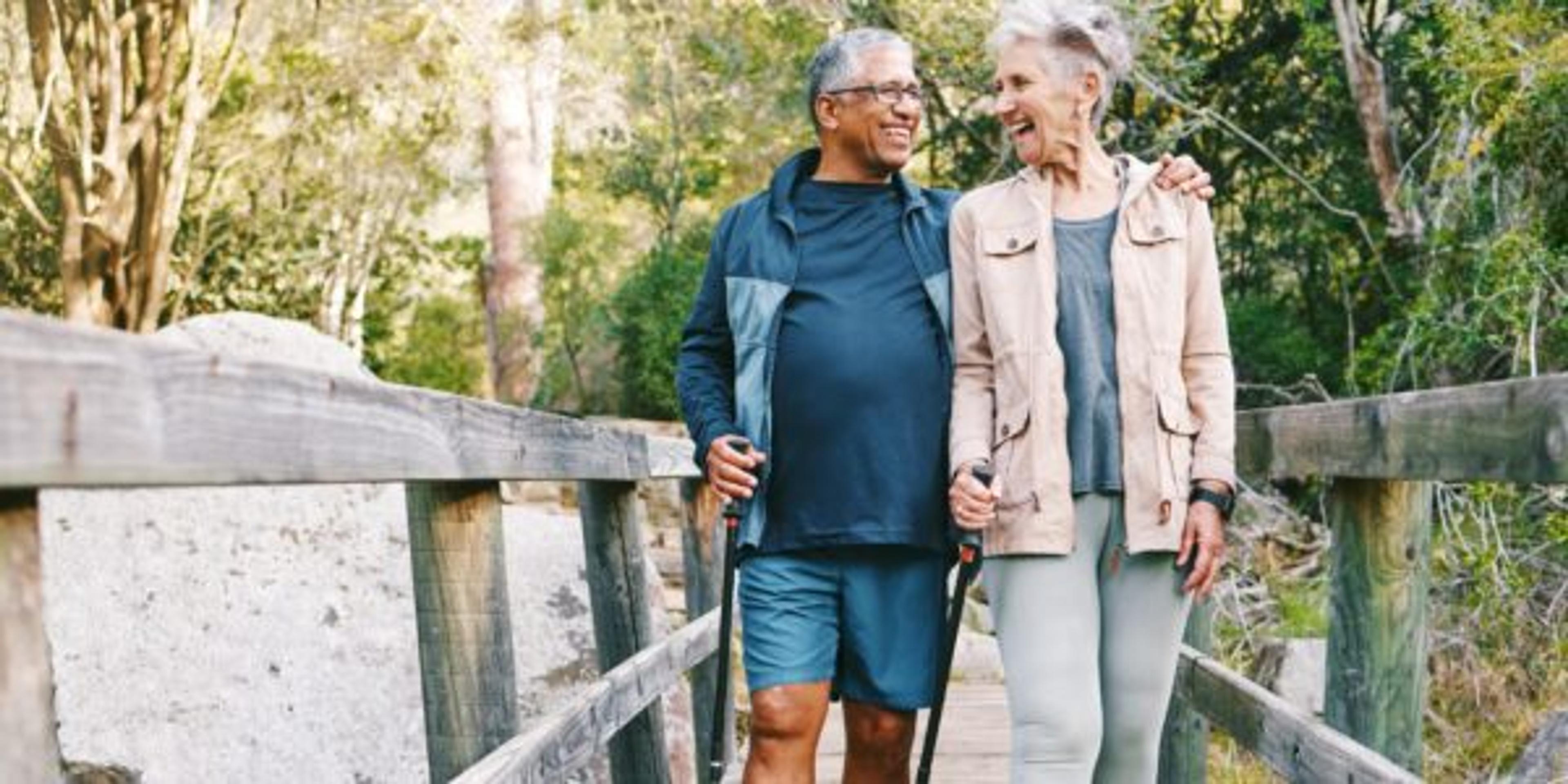 Senior couple hikes to protect their brain health through a healthy lifestyle