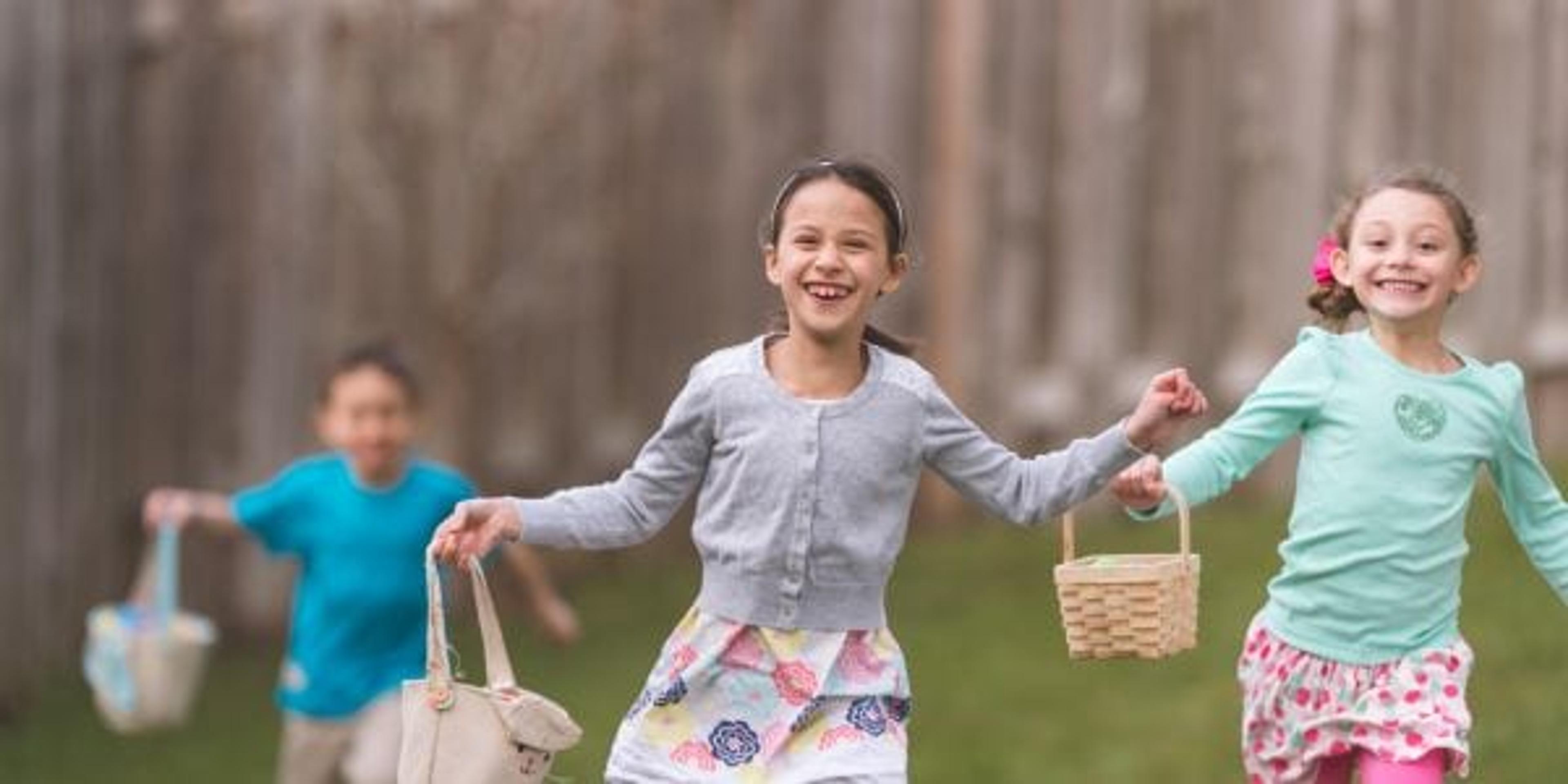 Kids running during an Easter Egg hunt.