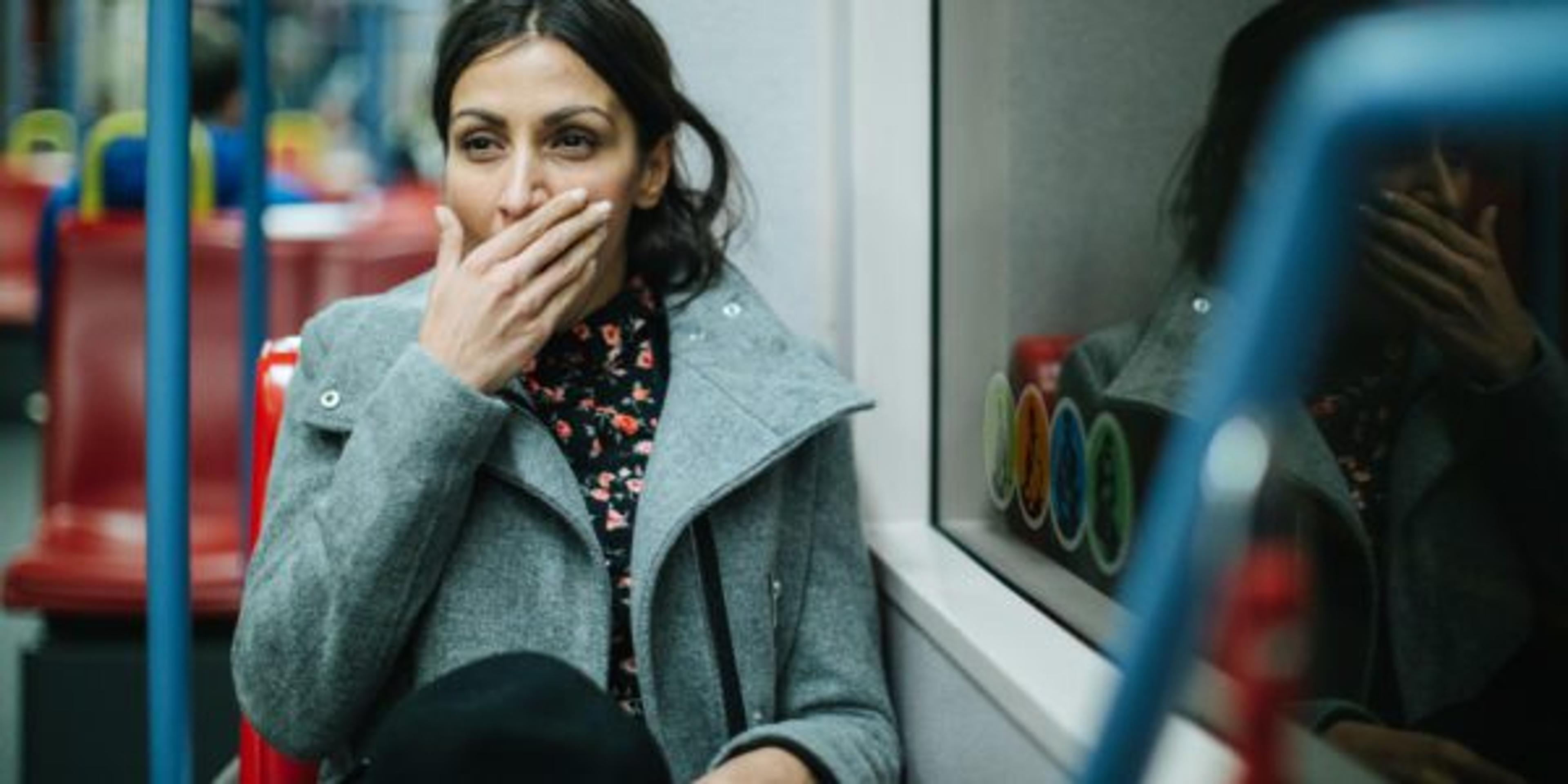 Tired woman in public transportation