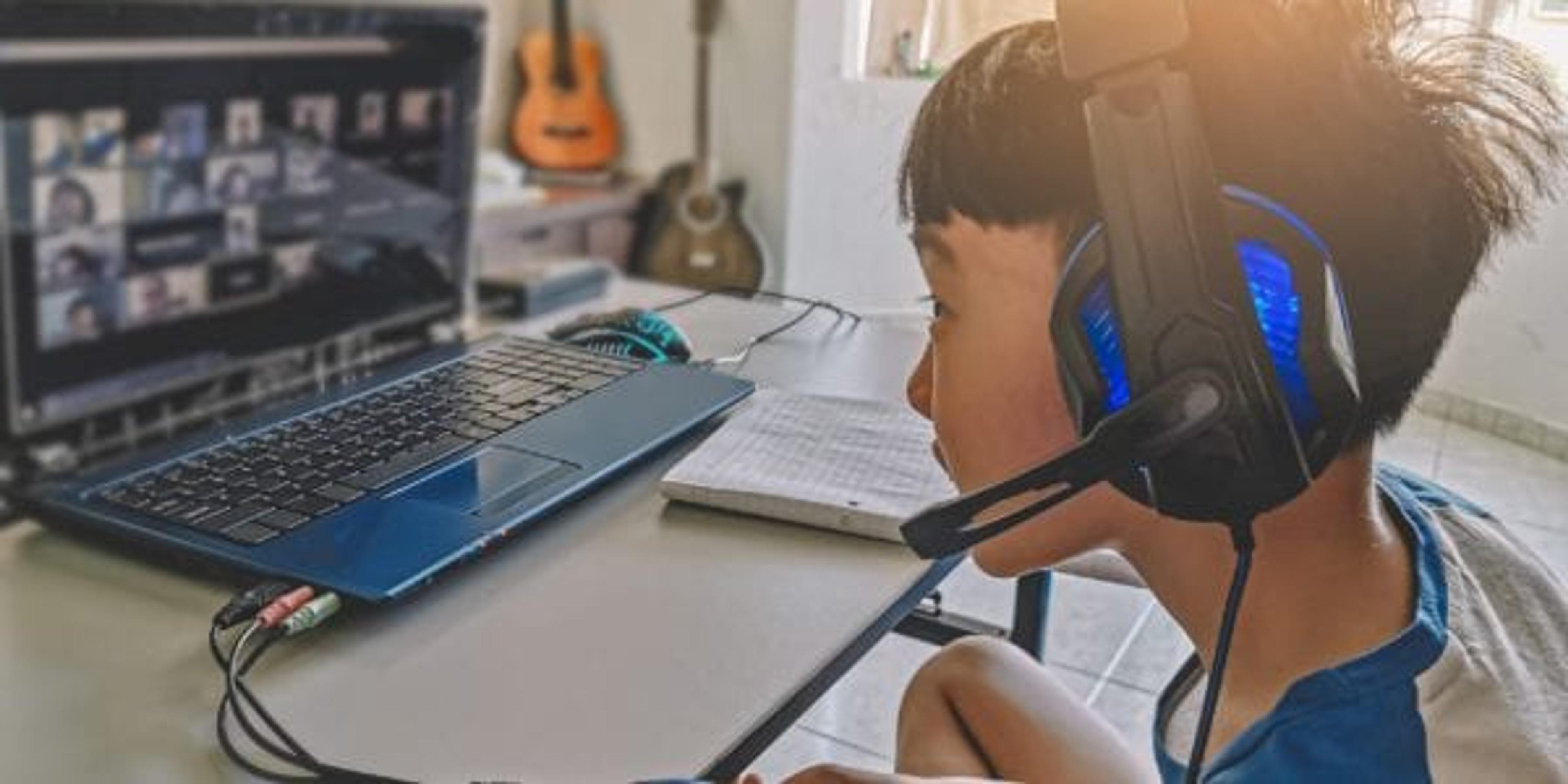 Boy on a video chat with his class