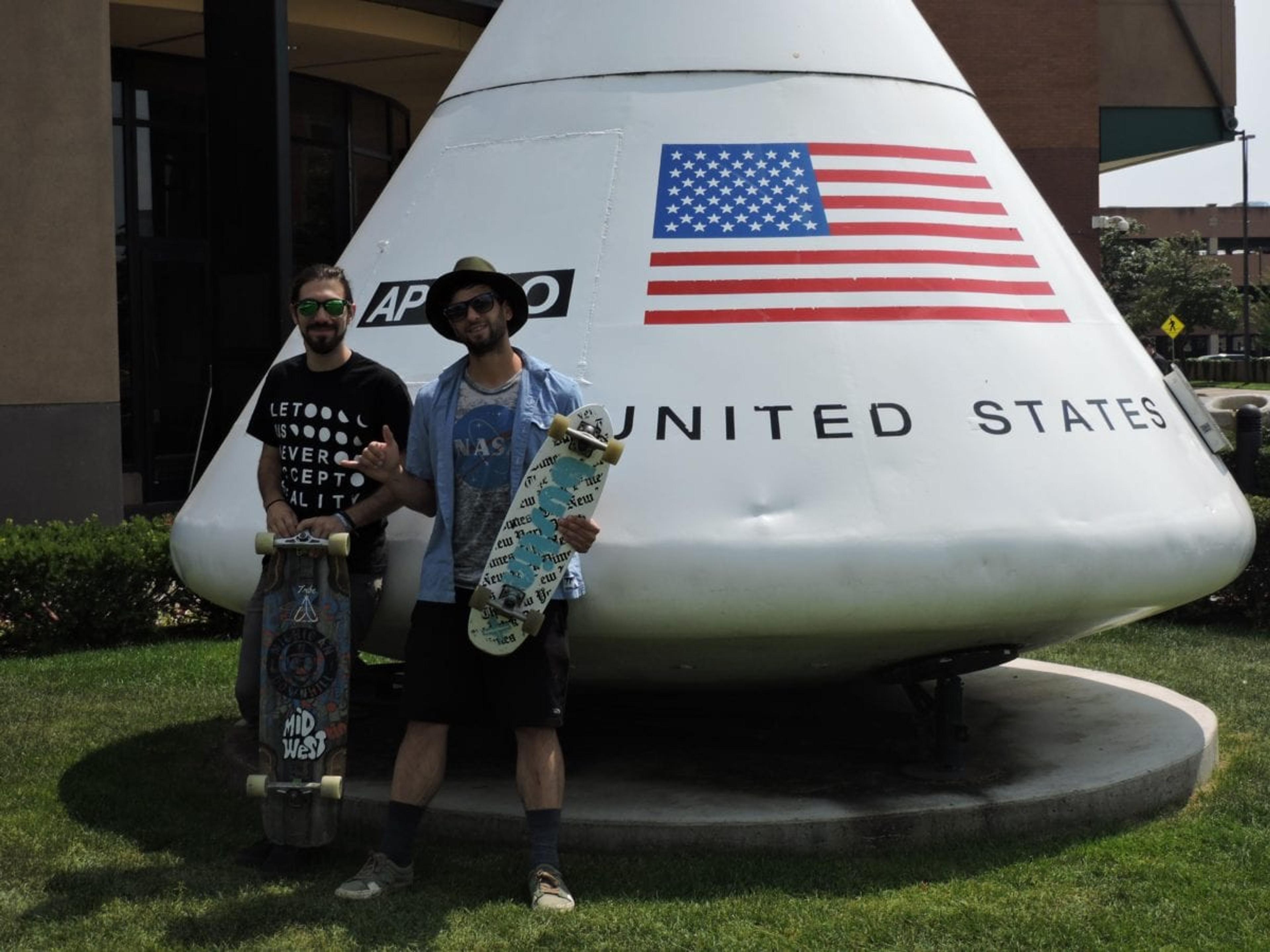 Ty Butler and Mike Dallas pose with their boards in front of the Grand Rapids Public Museum.