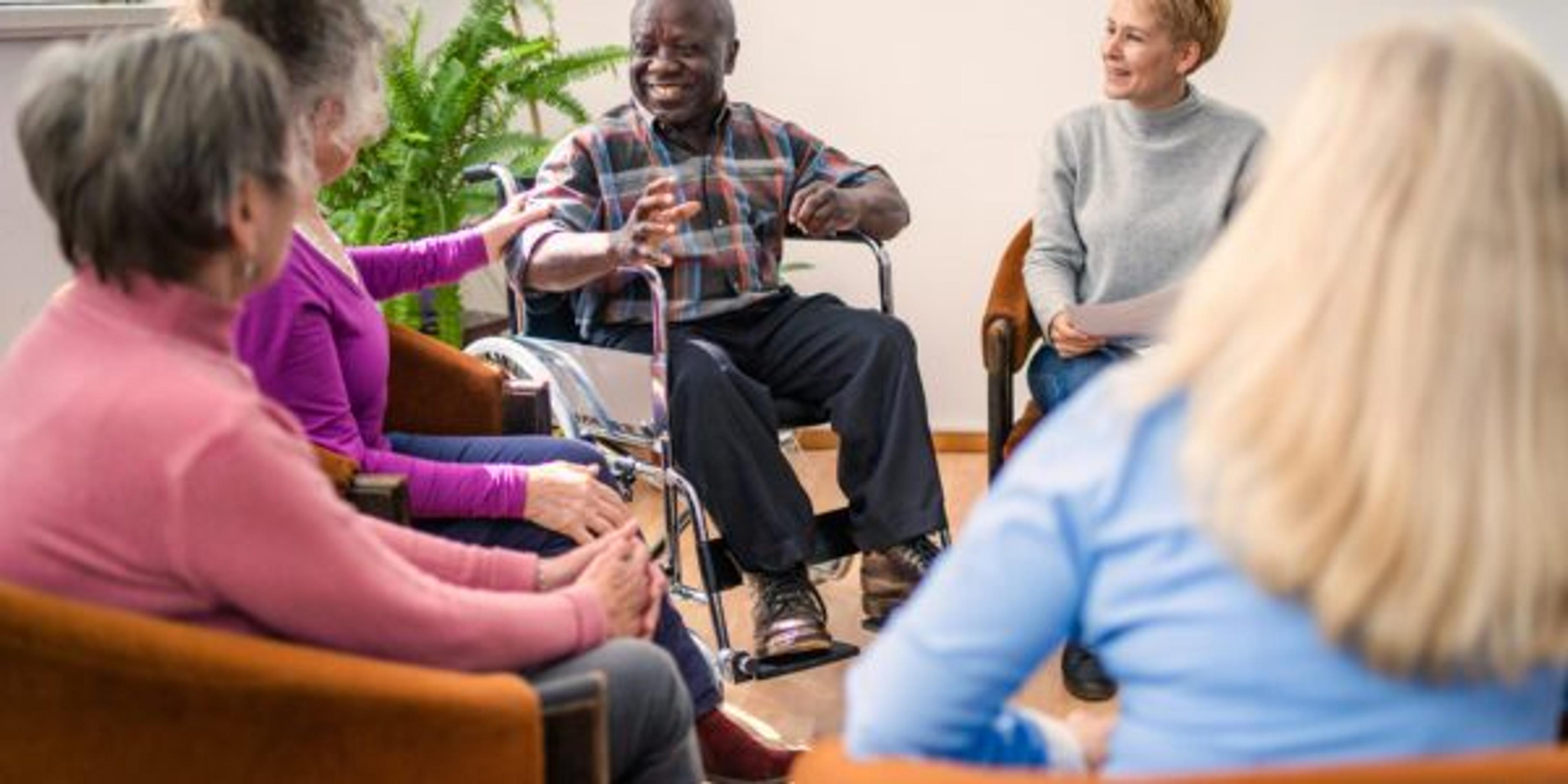 Group therapy in session sitting in a circle