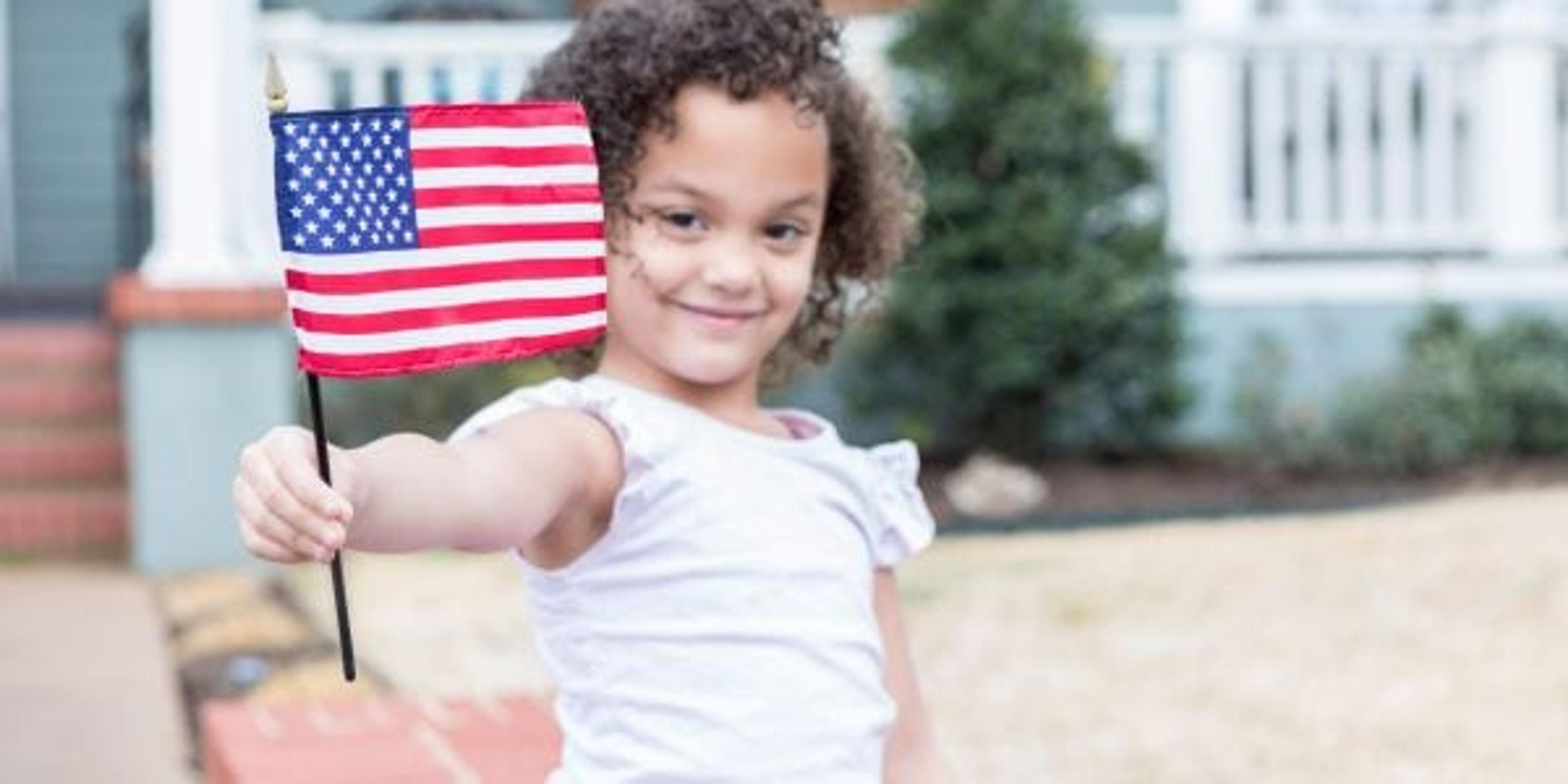 Little girl holding an American flag