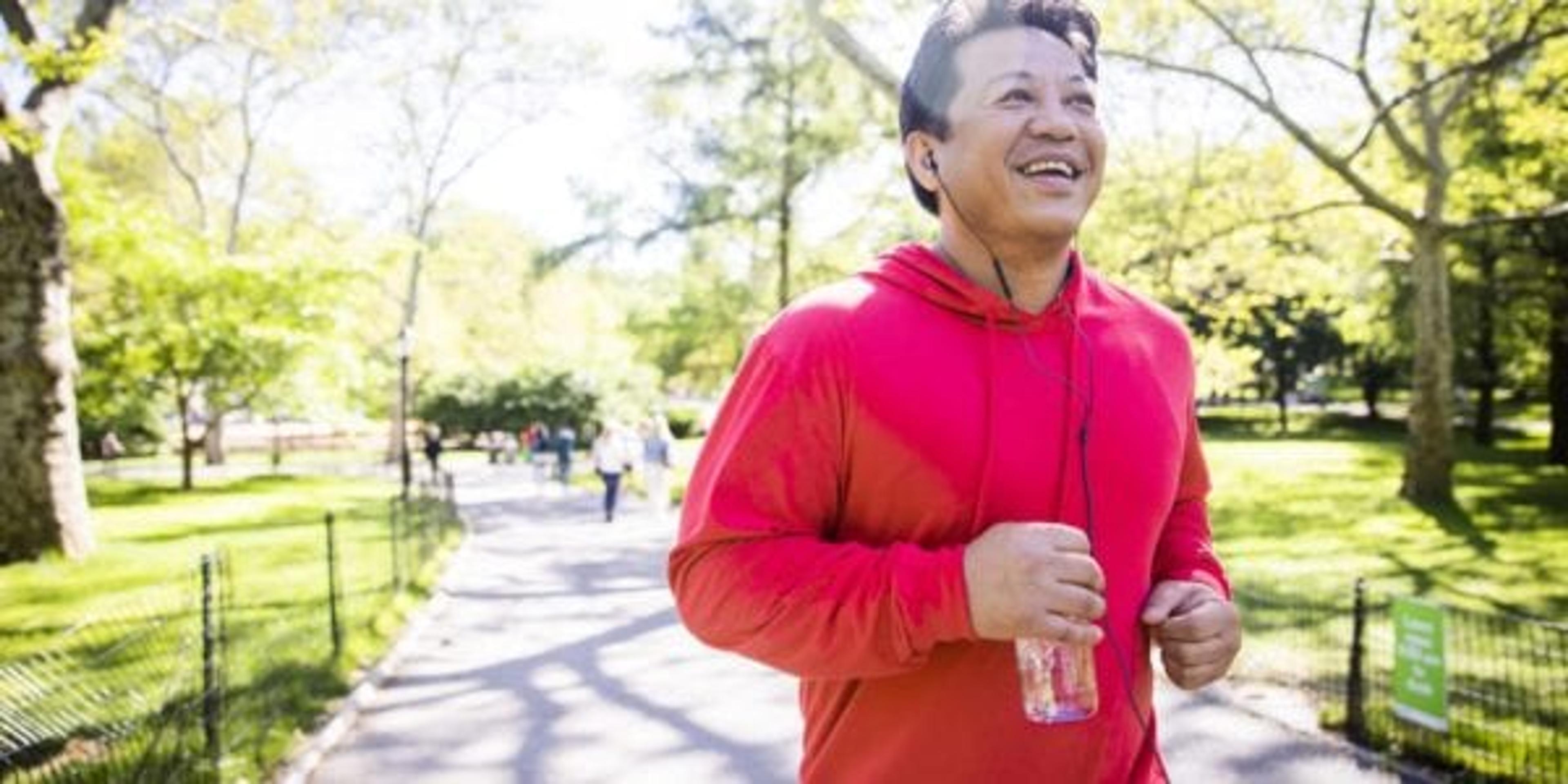 A mature hispanic man working out in central park in New York City