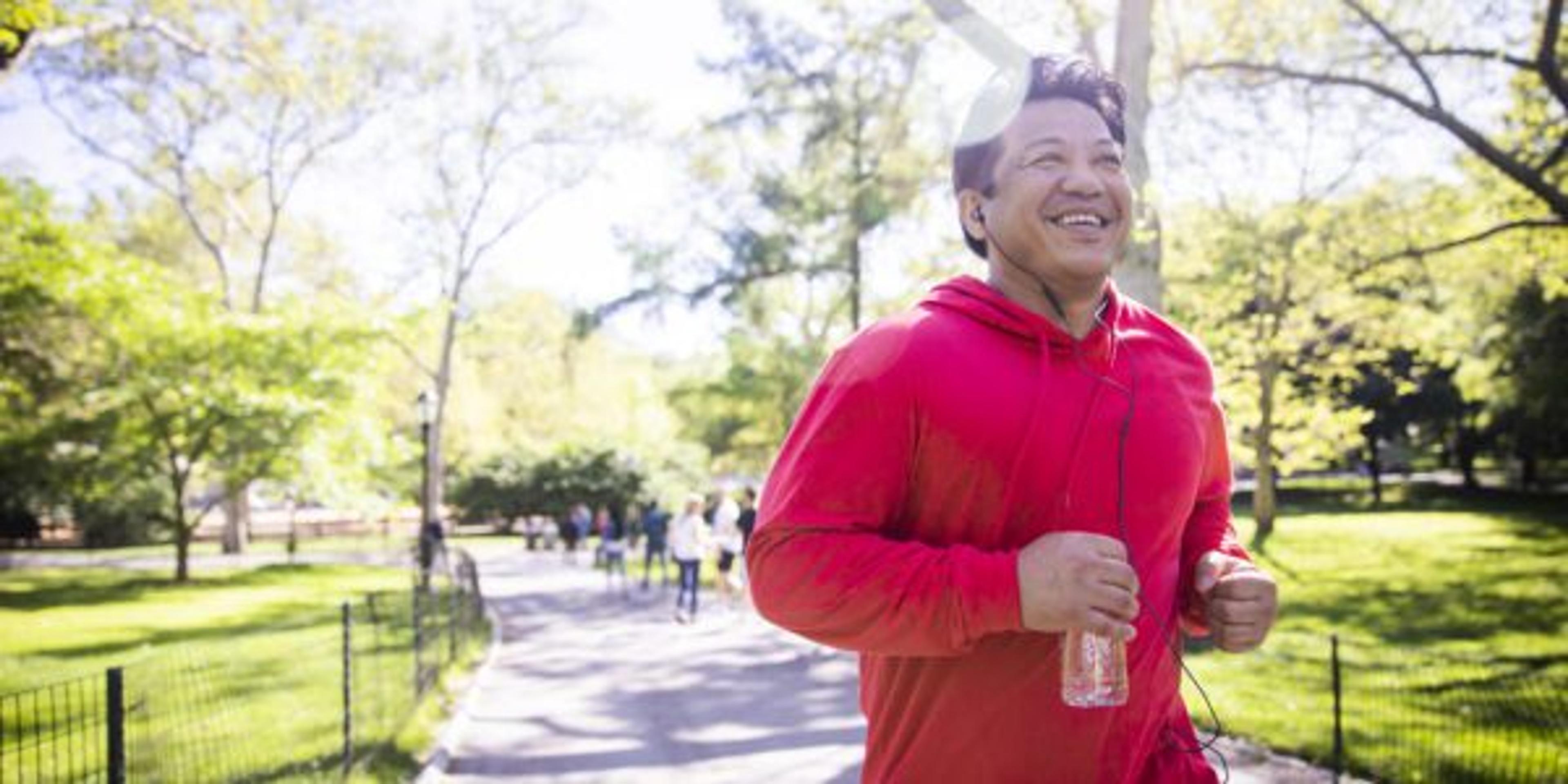 Mature Hispanic Man Jogging in Central Park