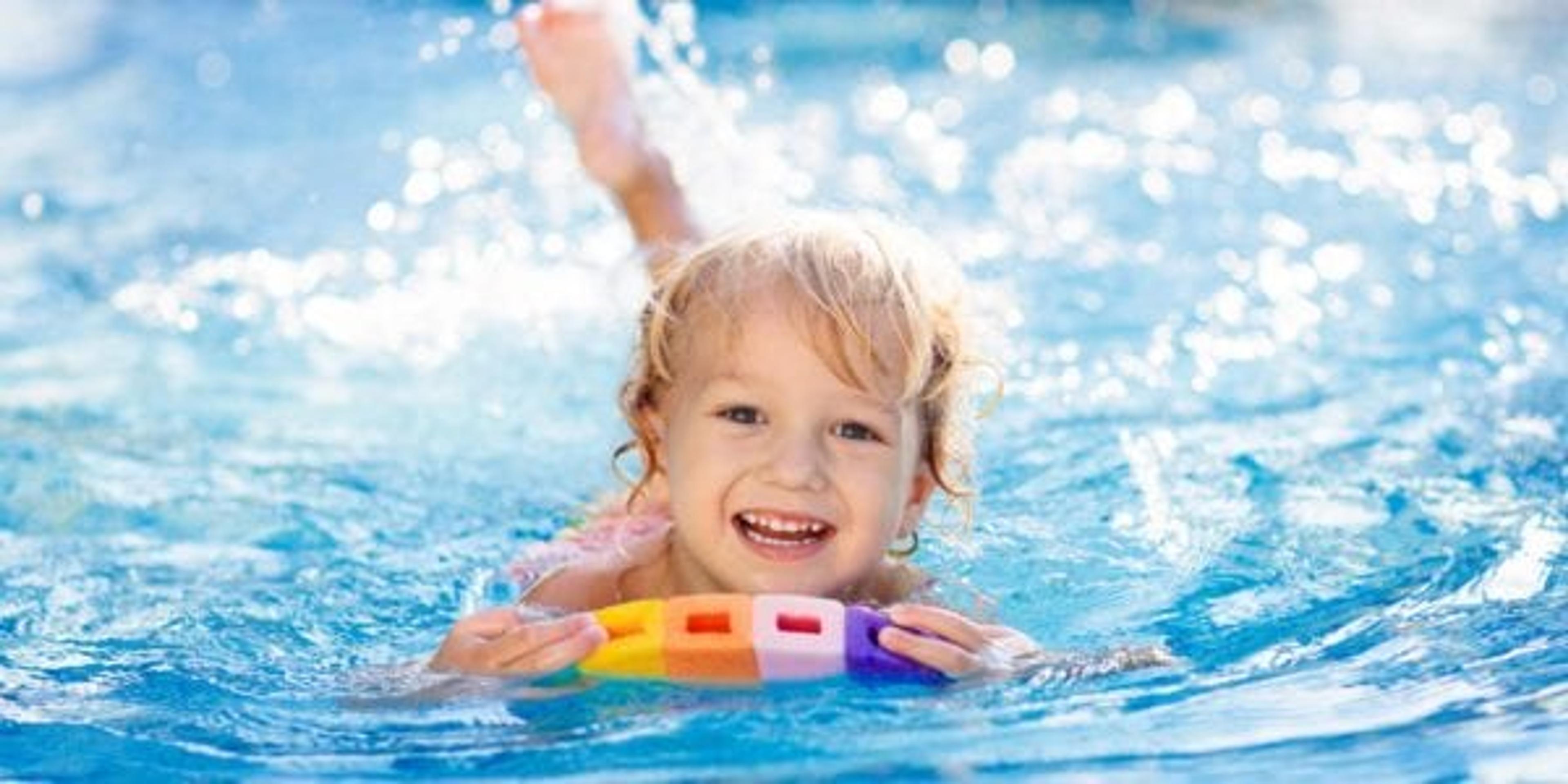 Young Child Learning to Swim