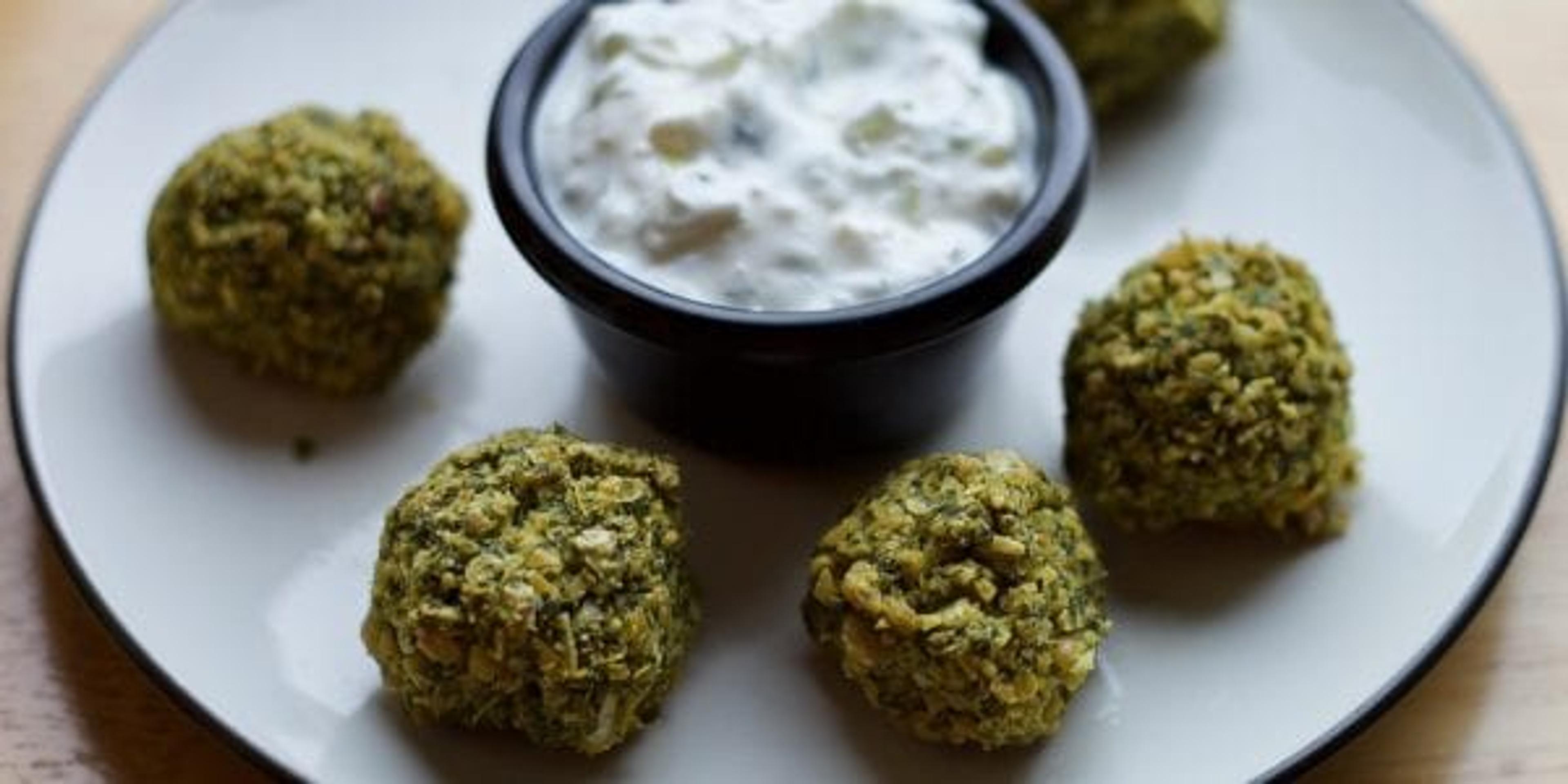 Baked falafel on a plate with dip