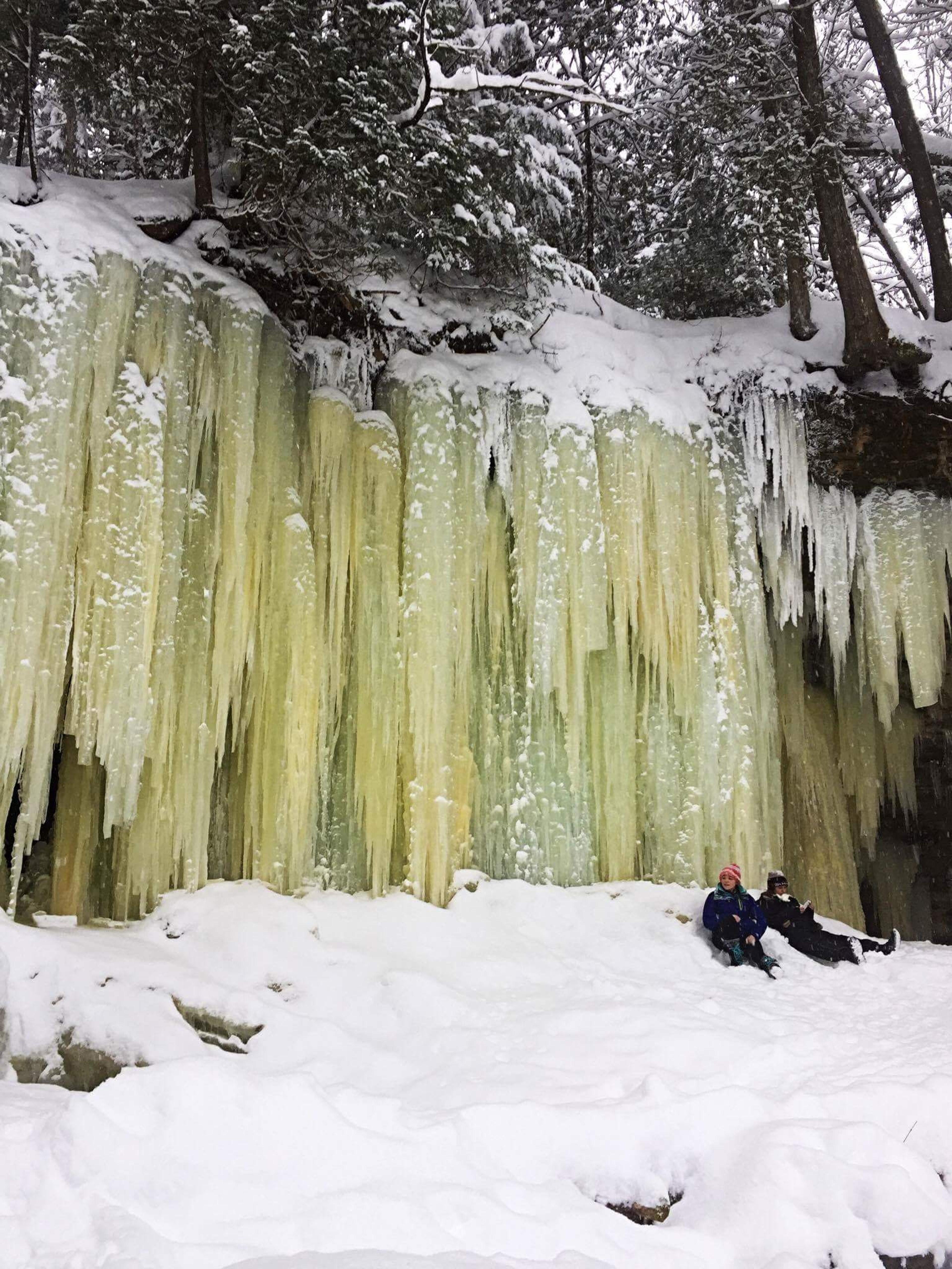 Two hikers hanging out by the ice caves.