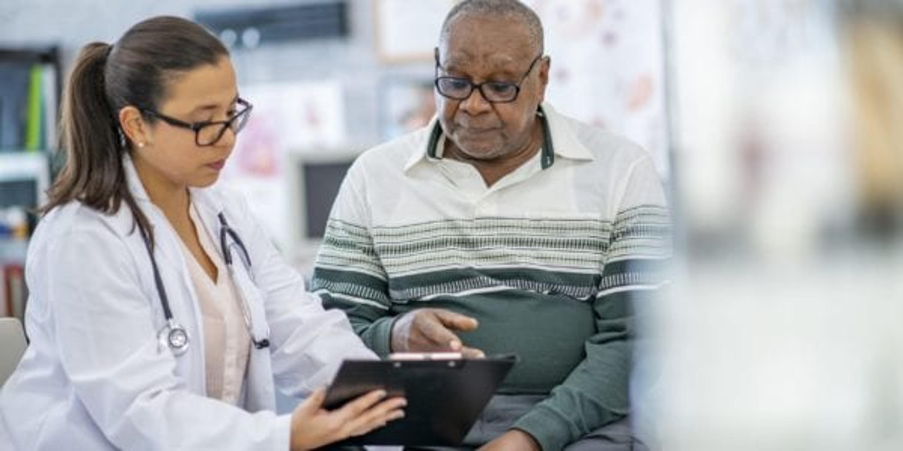 Older man talking to his doctor