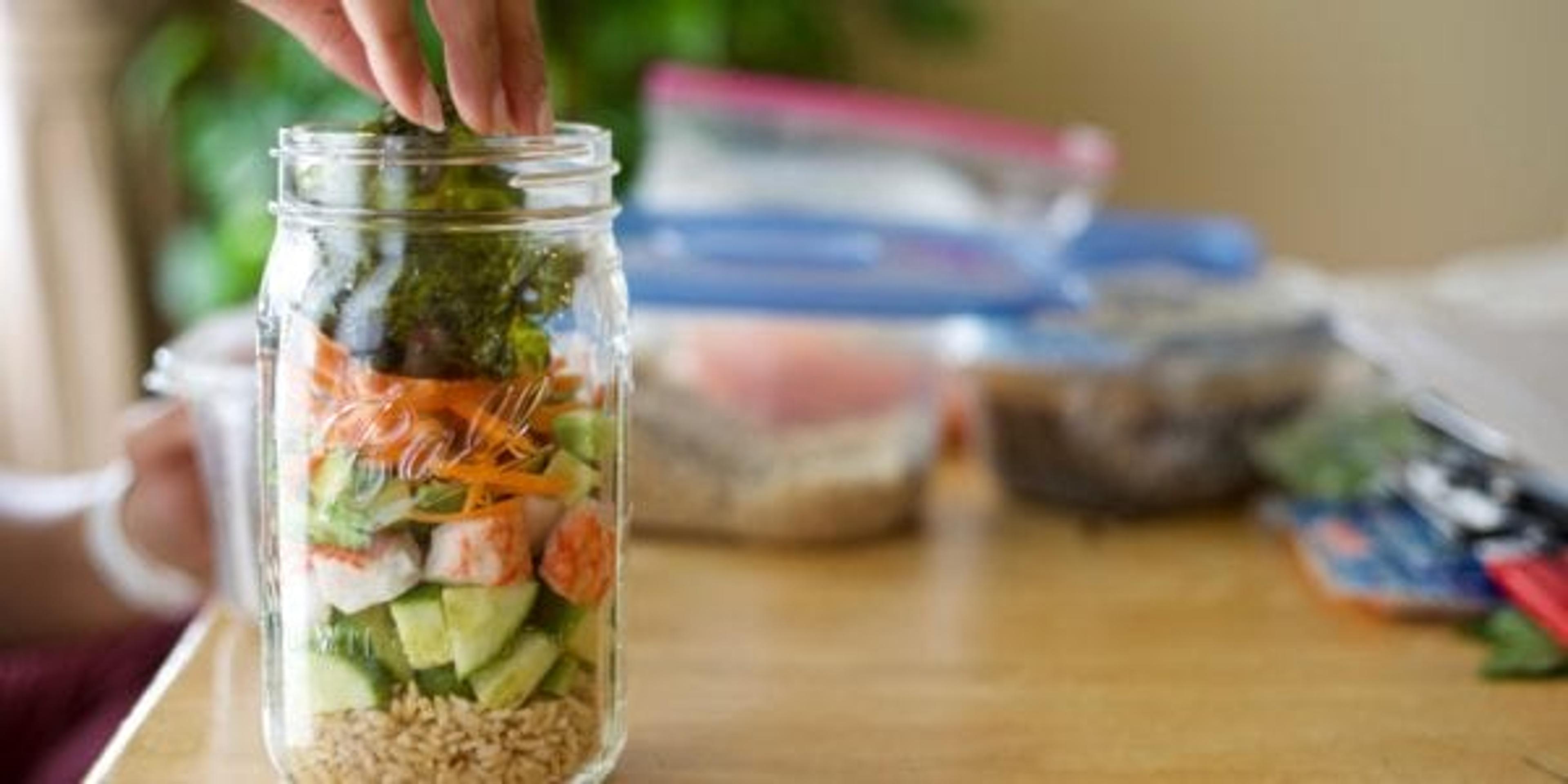 Mason jar preparation on a kitchen table.