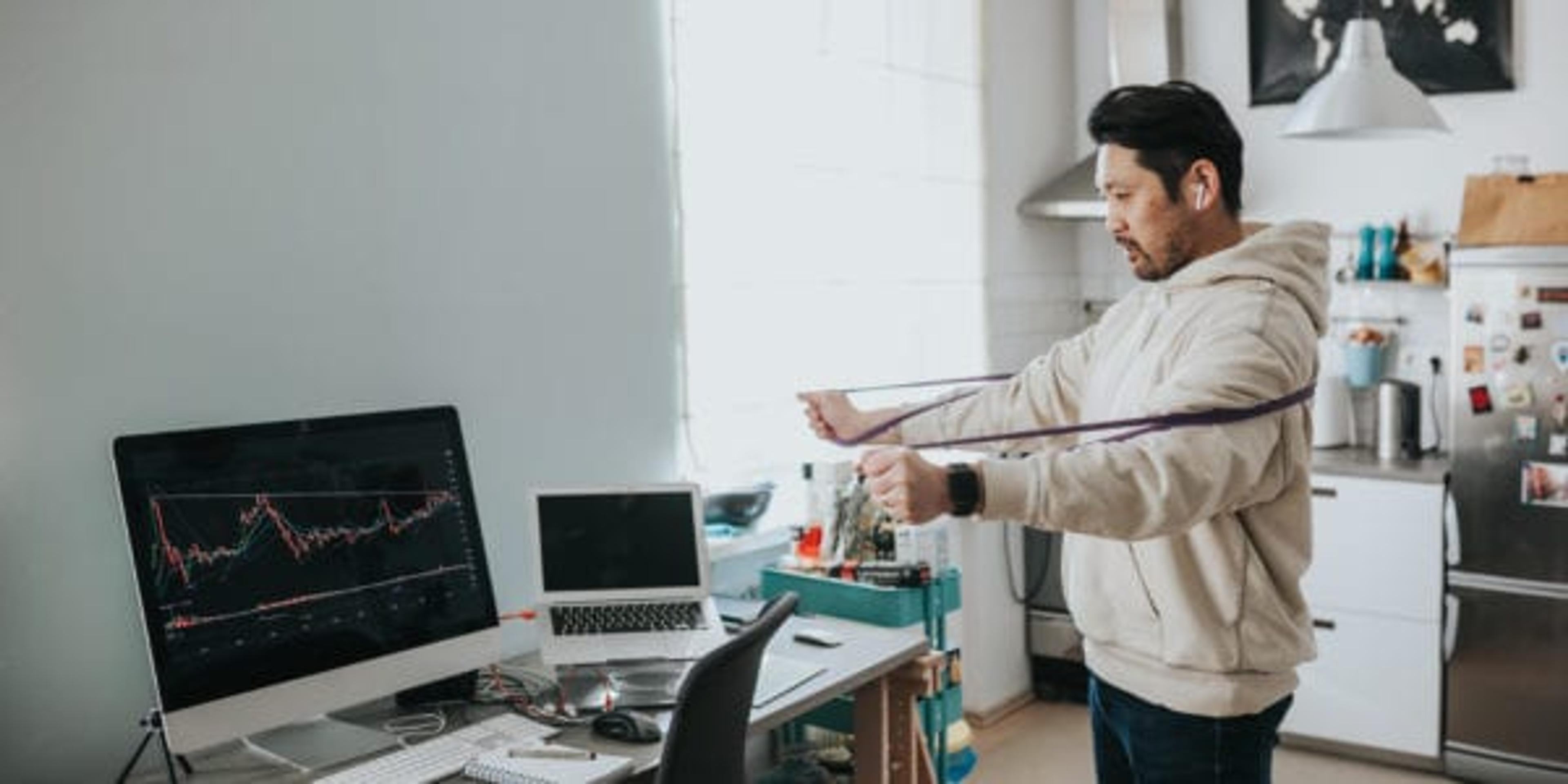 Man working out at desk.