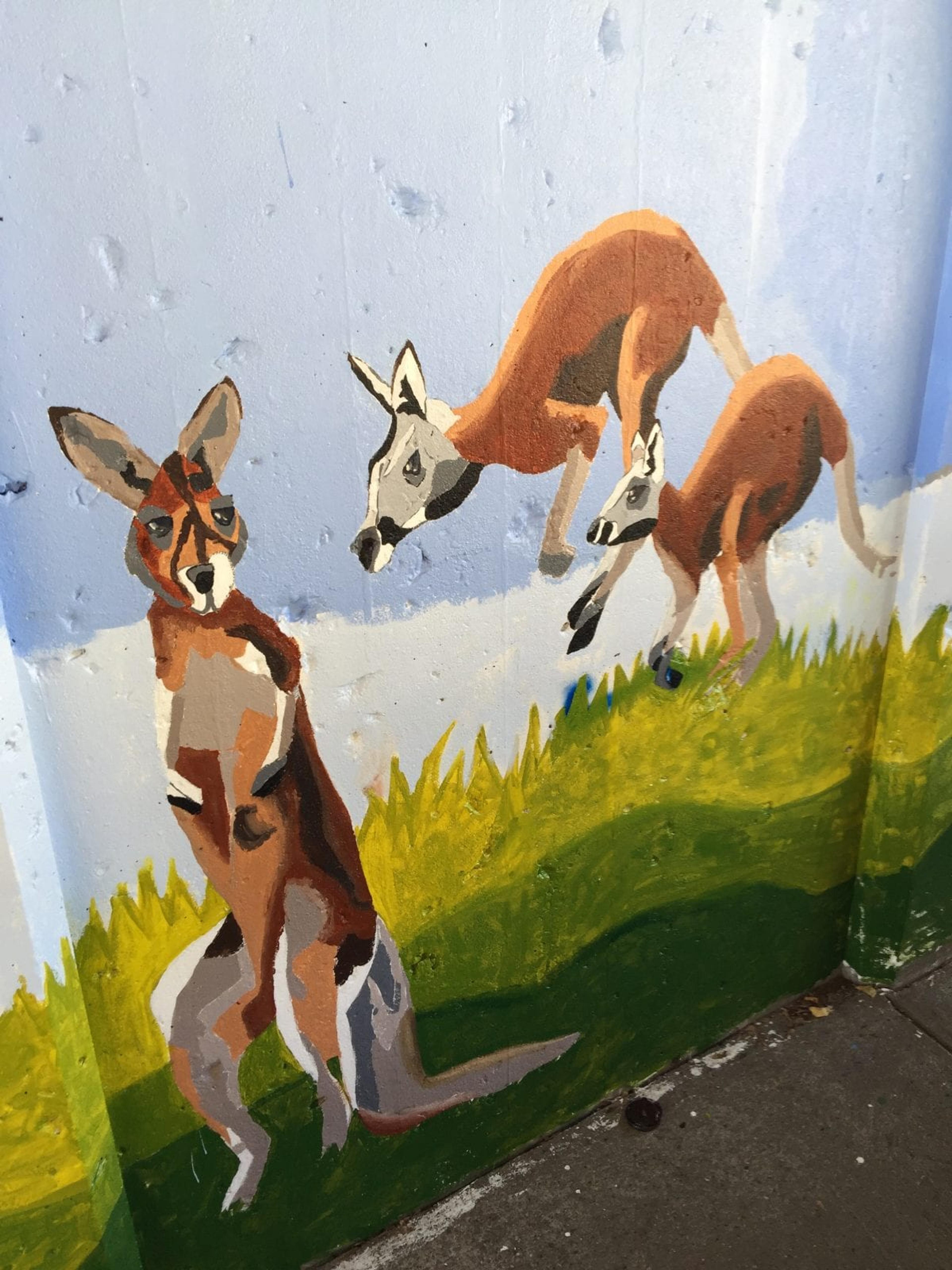A painted mural of kangaroos