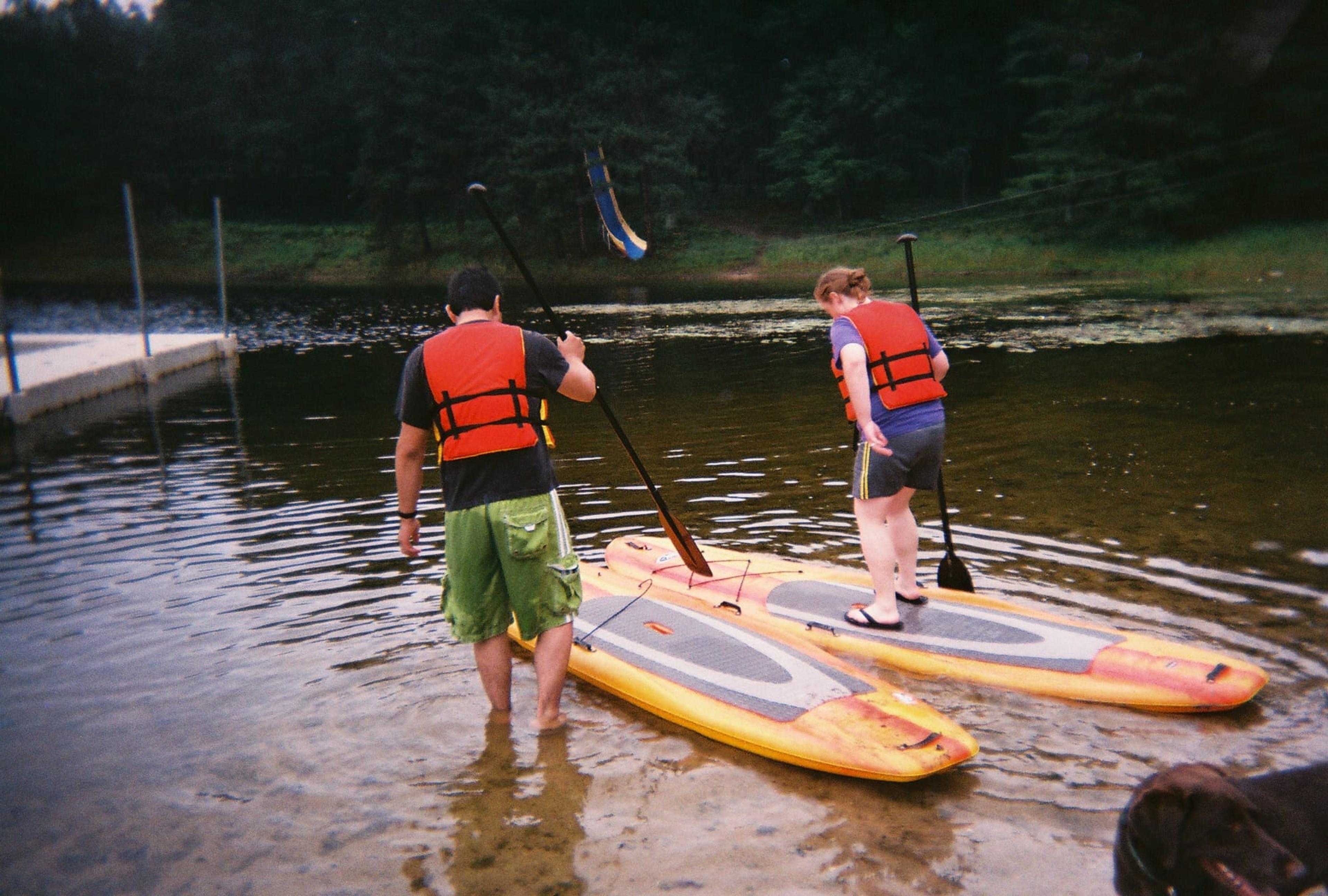 Campers taking part in stand-up paddleboarding lessons at last year's Camp Kitigin. 
