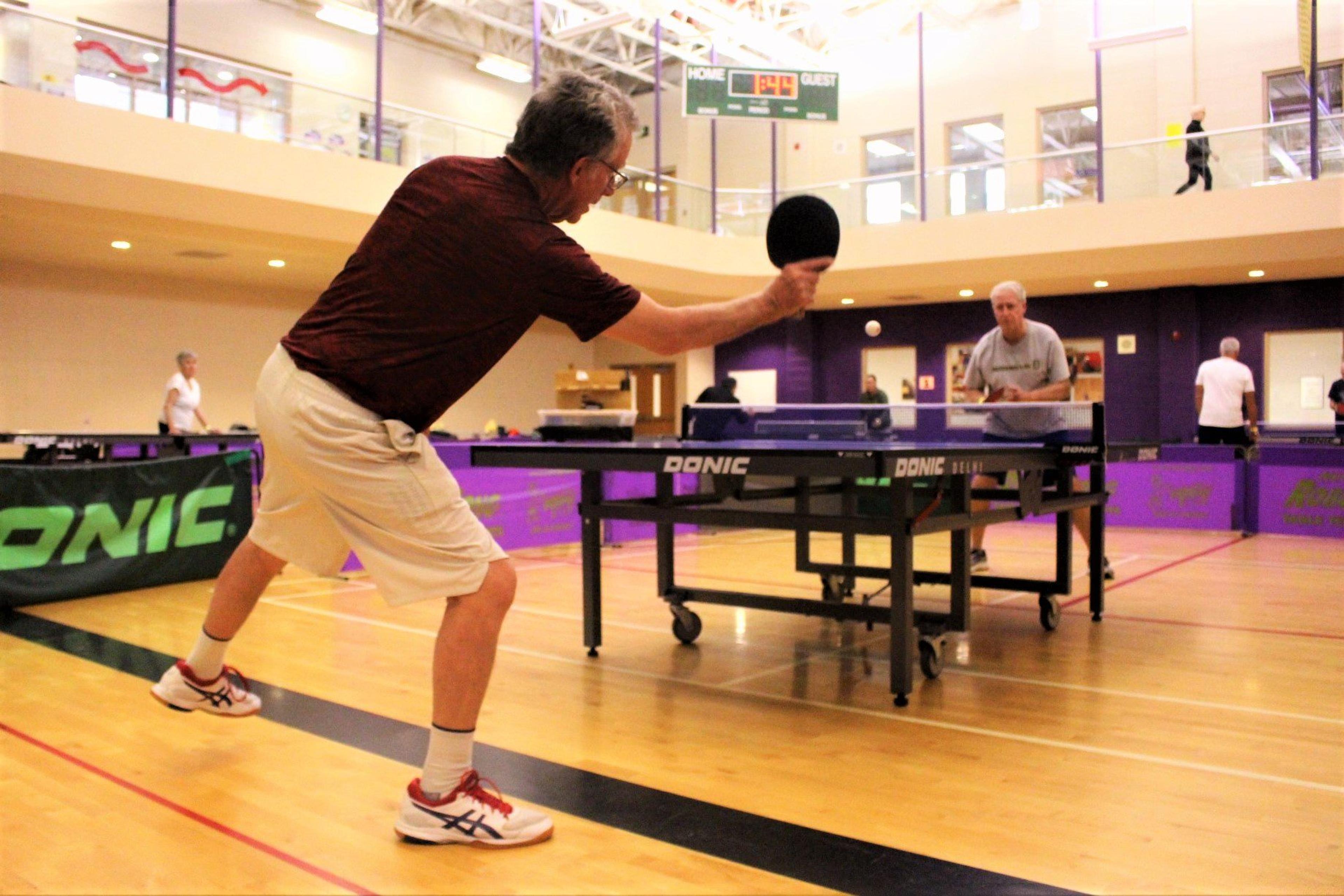 Bob Van Camp plays table tennis at the Older Persons Commission