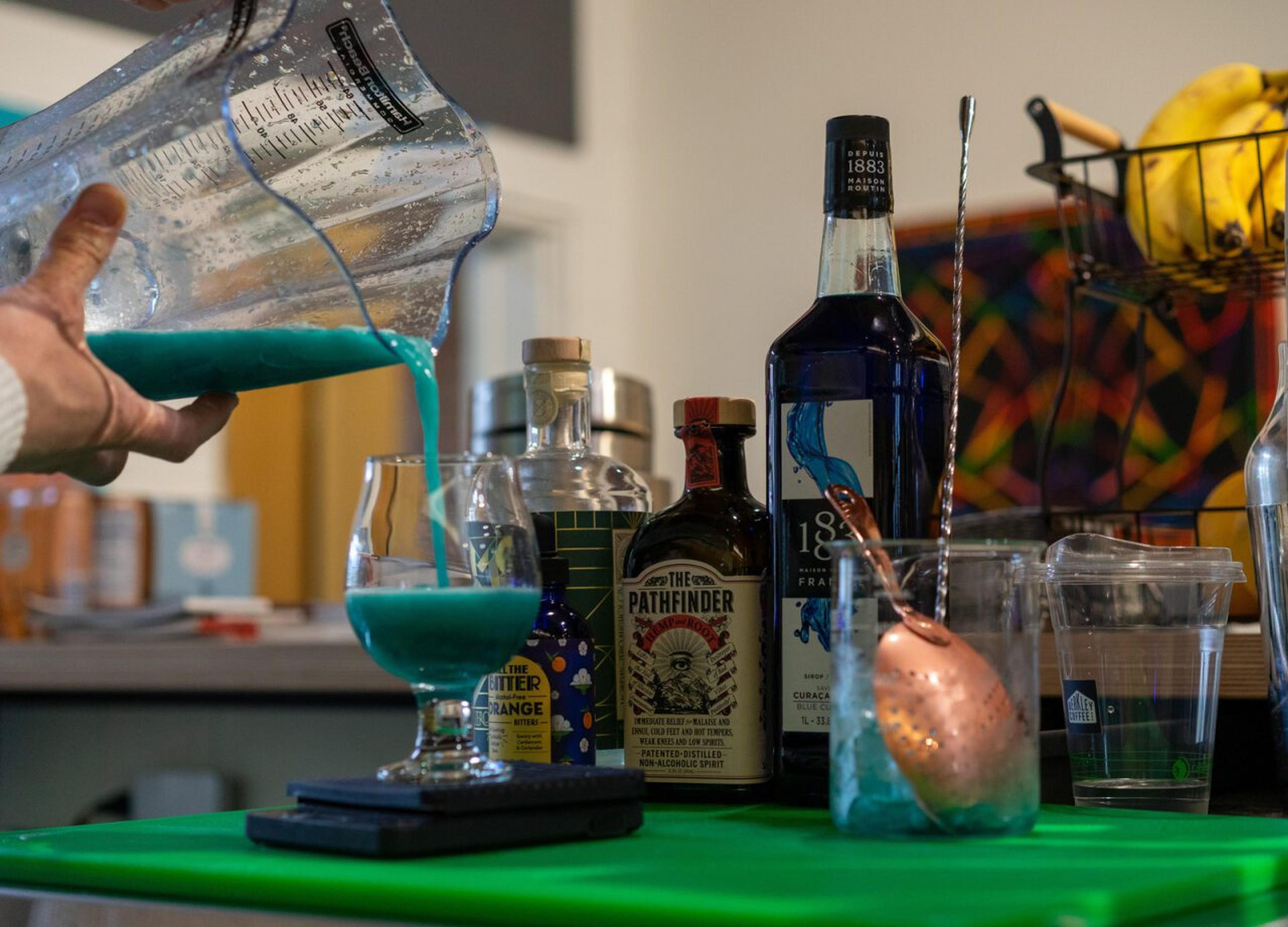 An Oak Park Dry employee makes a mixed drink.
