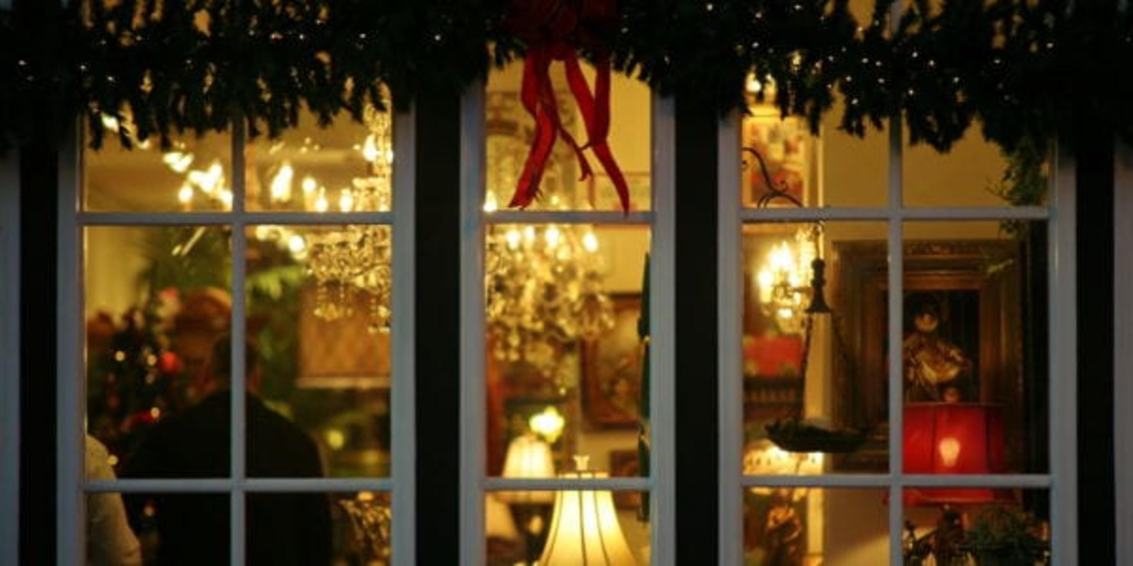 Outside view of a home covered in Christmas decorations