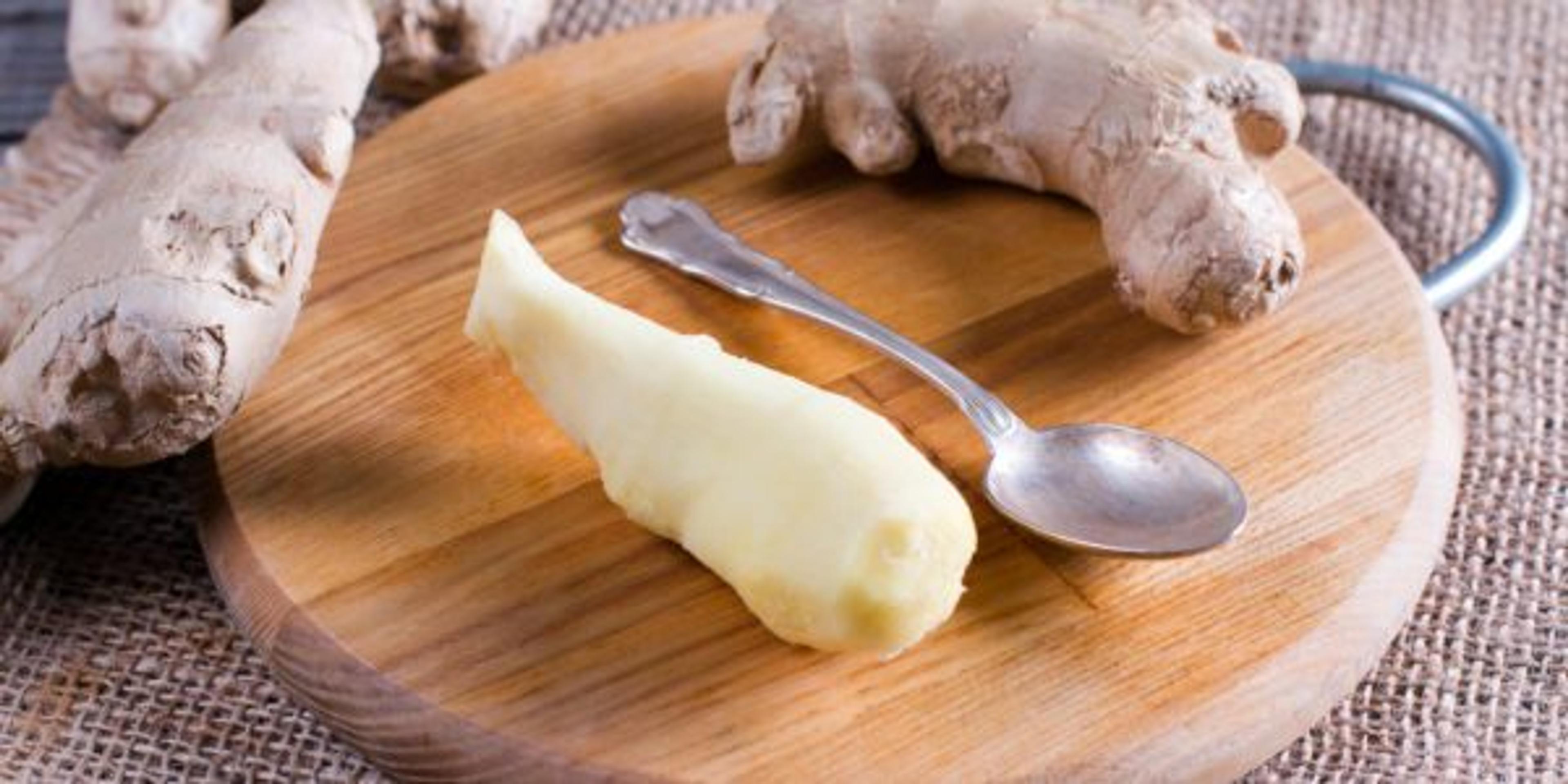 Peeled ginger root on a cutting board