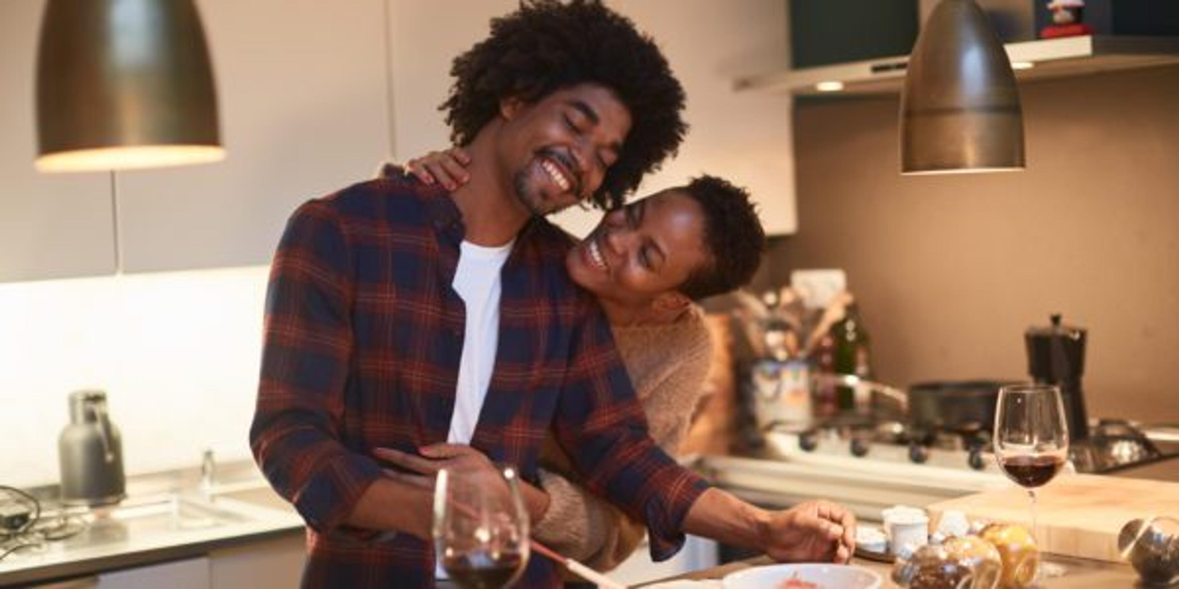 Young couple cooking at home and celebrating Saint Valentine