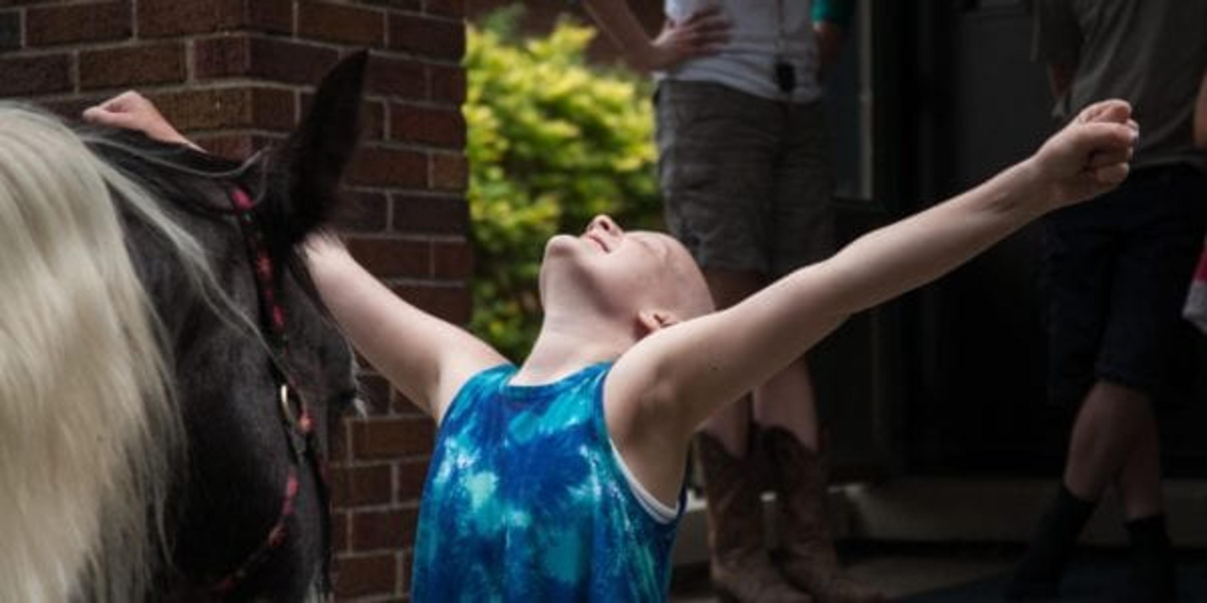 Little girl celebrates her horsey house call