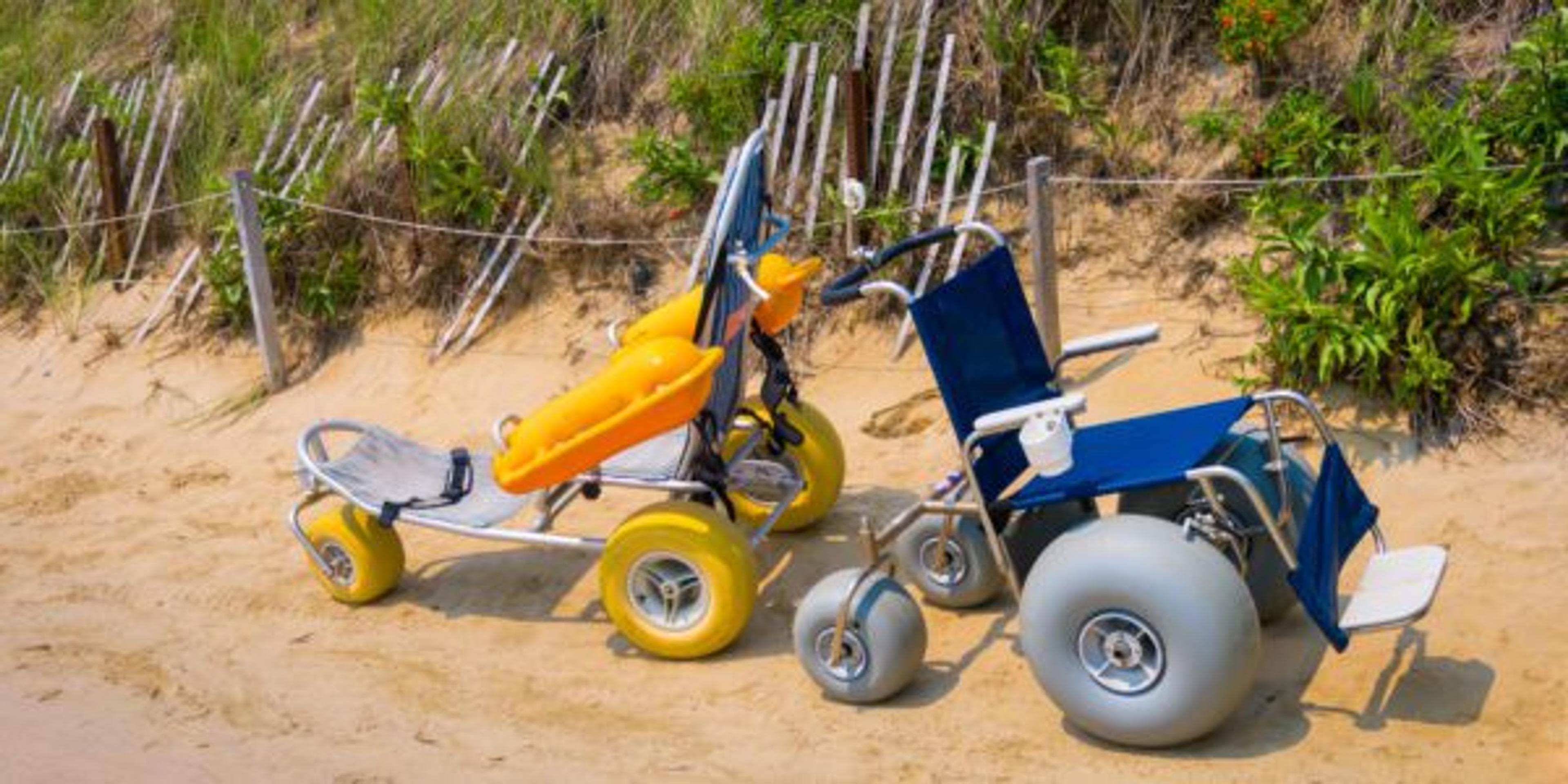 Track chairs on the beach. Beach wheelchairs help expand access to lakes.