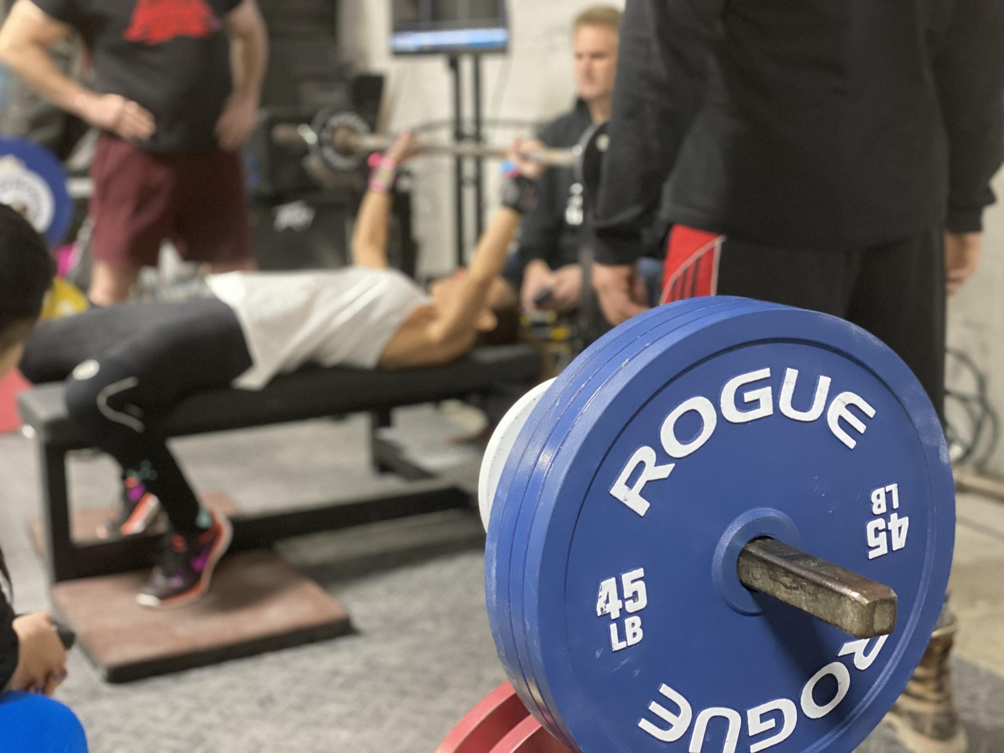 A woman bench presses