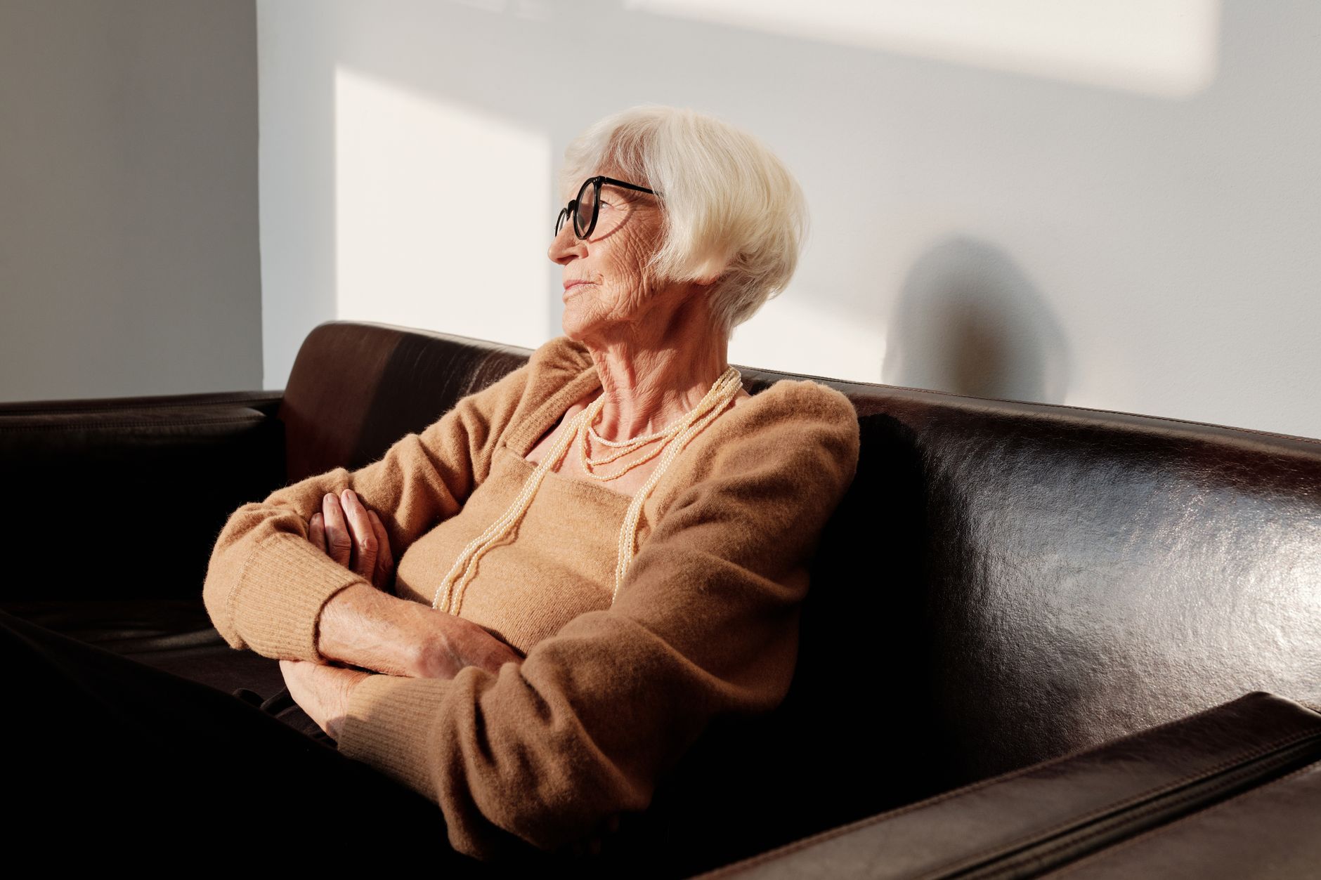 An elderly woman resting peacefully in the afternoon sun