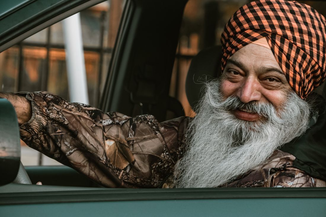 An older man with a flowing beard, smiling warmly