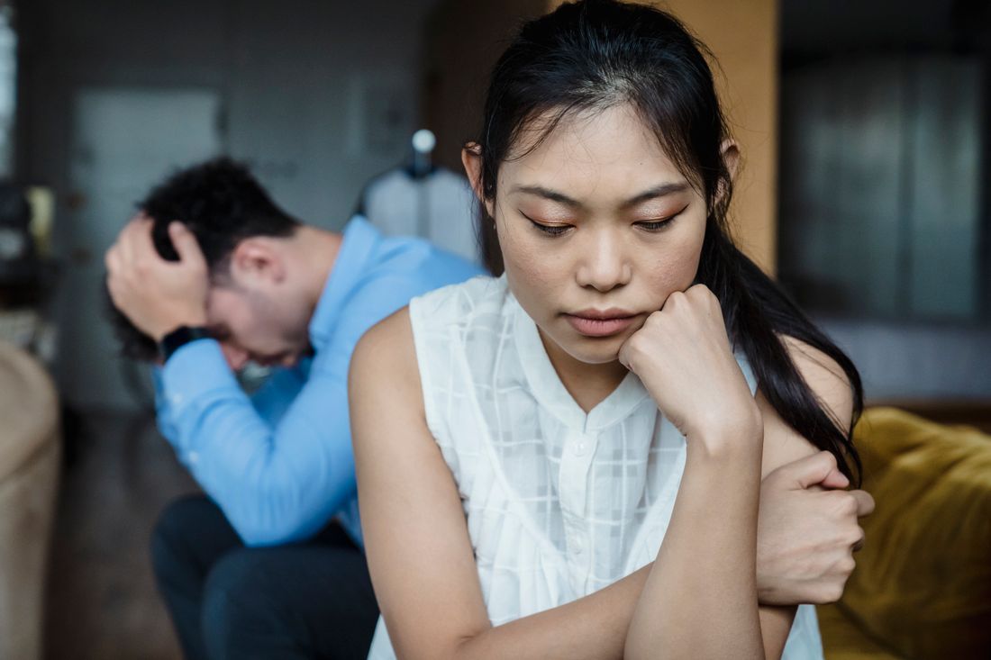 A husband and wife sitting in the strain of an unresolved moment