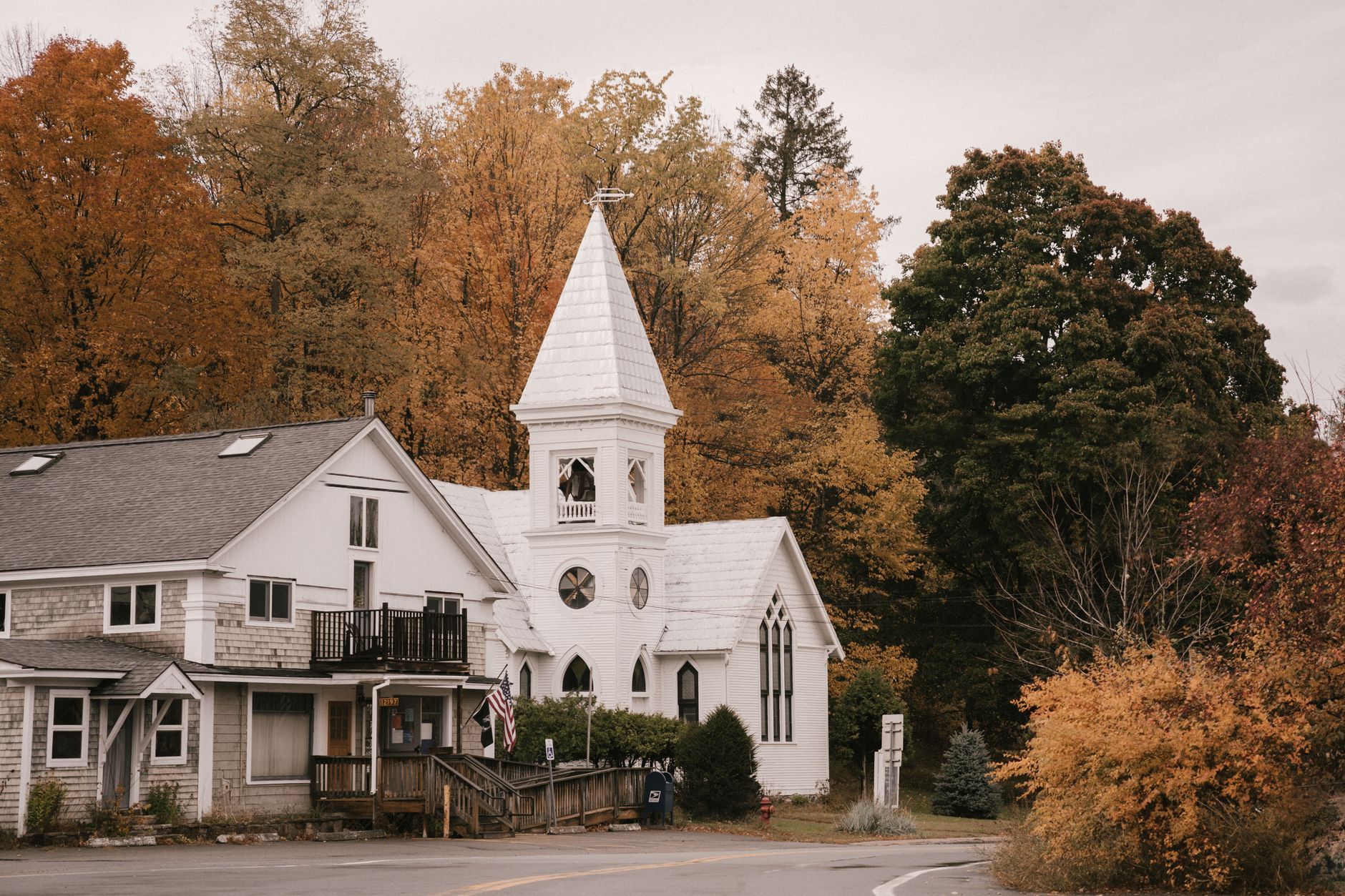 A white clapboard church in New England in autumn