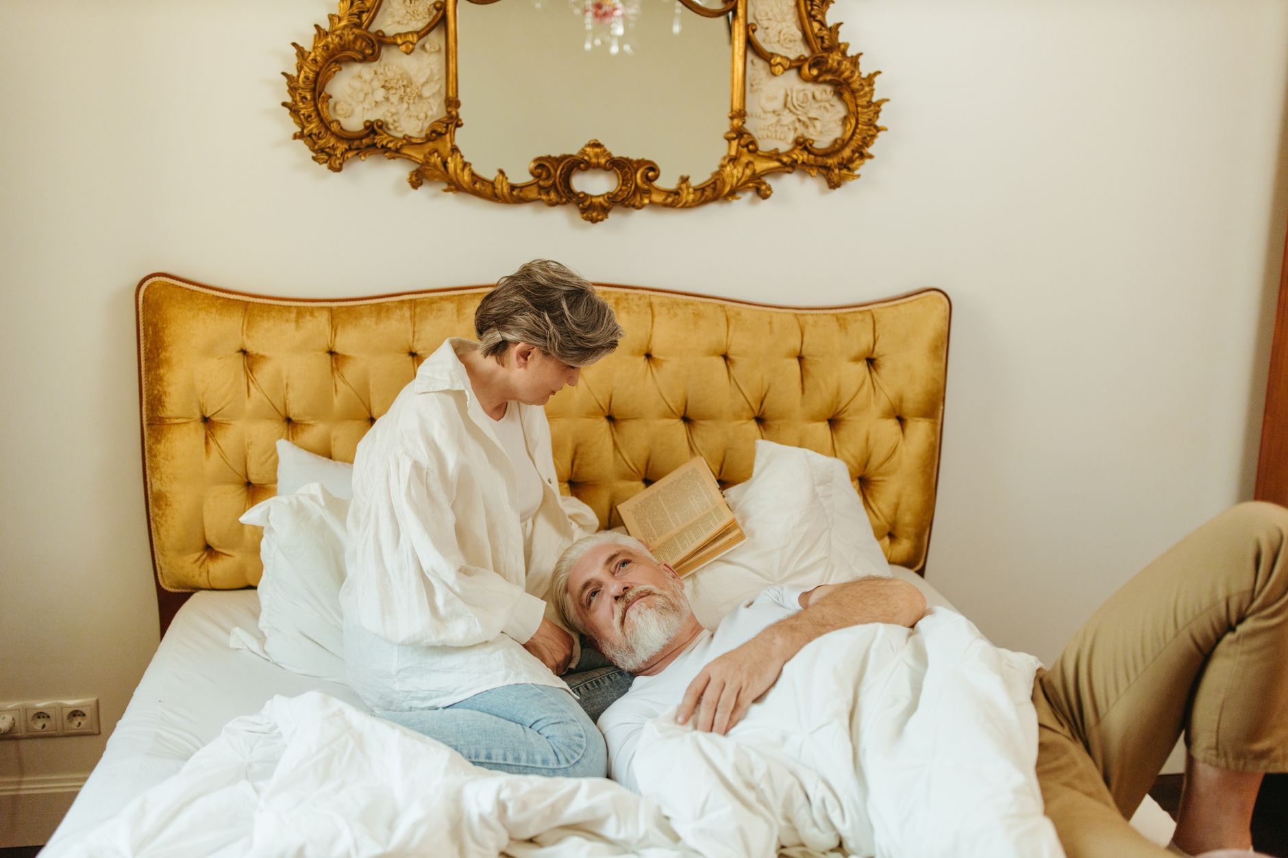 A woman caring for her resting husband at home