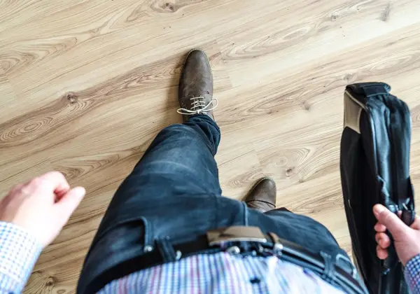 A person taking a first step forward into a new chapter