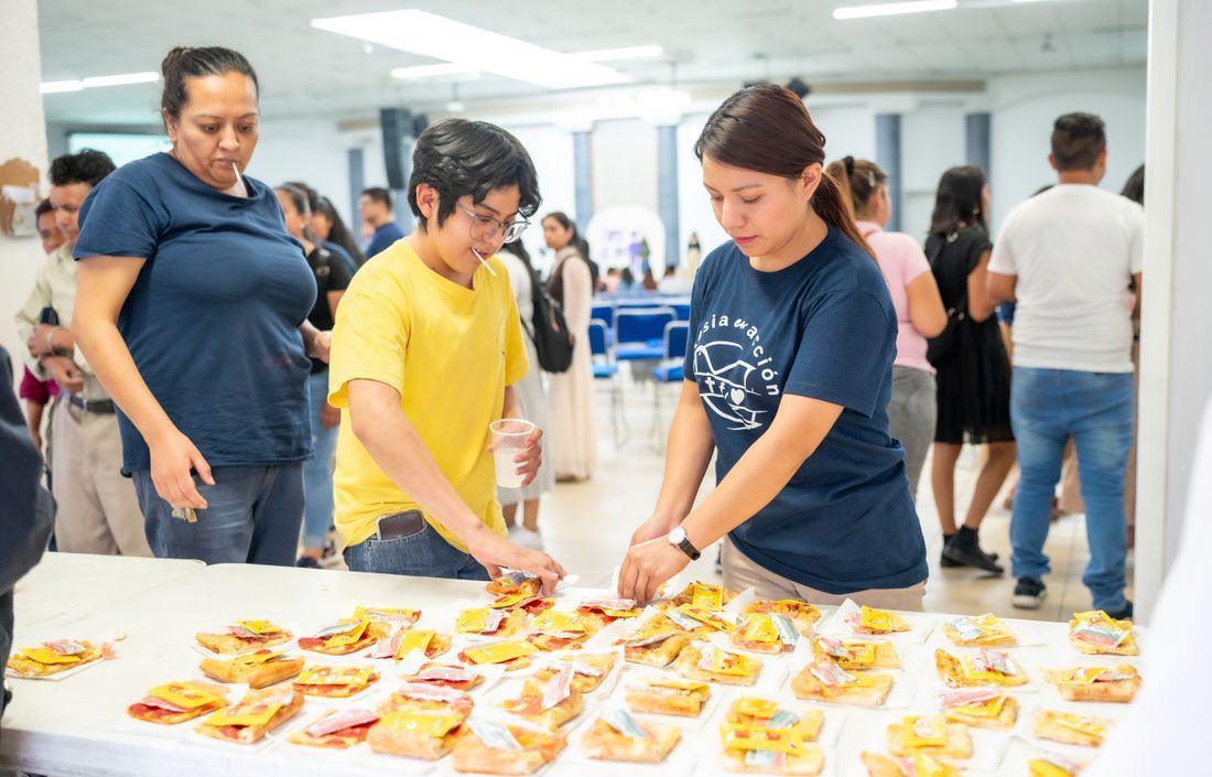 Church volunteers setting out refreshments to serve people at an event