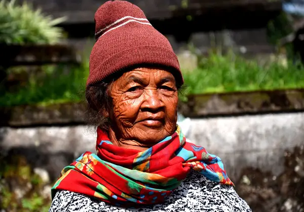 A dignified elderly Indonesian woman