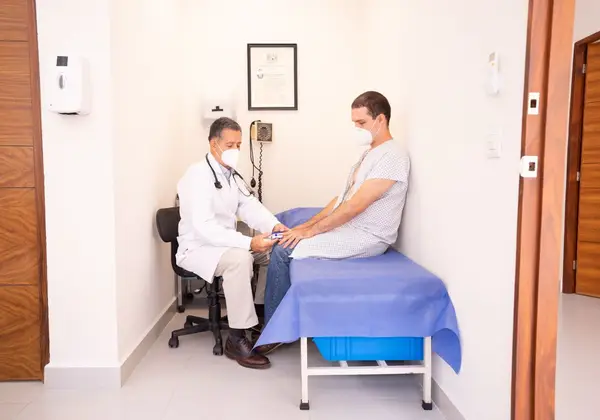 An experienced physician carefully examining a patient