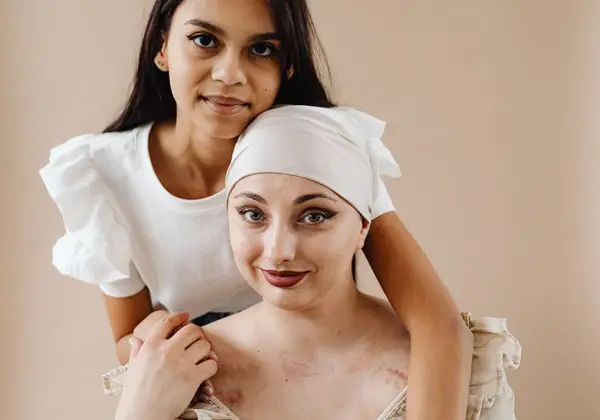 A cancer patient and a loved one together, hopeful and unafraid