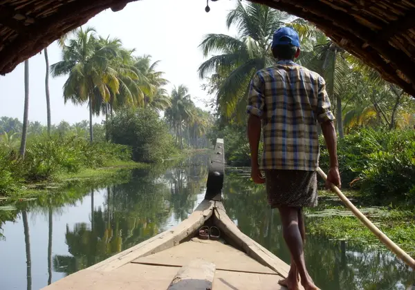 Houseboat on the palm-lined backwaters of Kerala, India