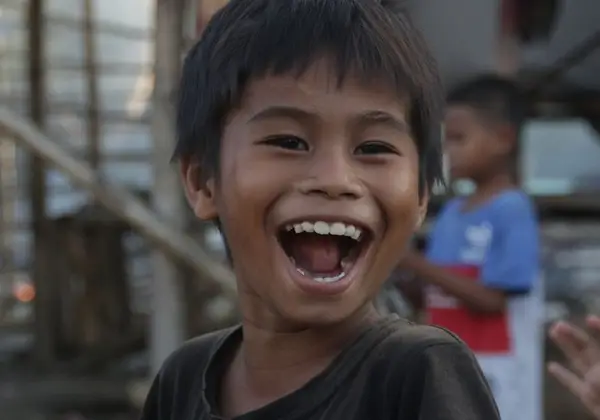 A laughing boy full of delight