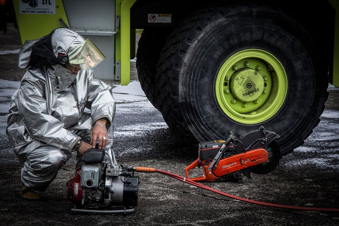 A firefighter in a protective suit working a difficult scene