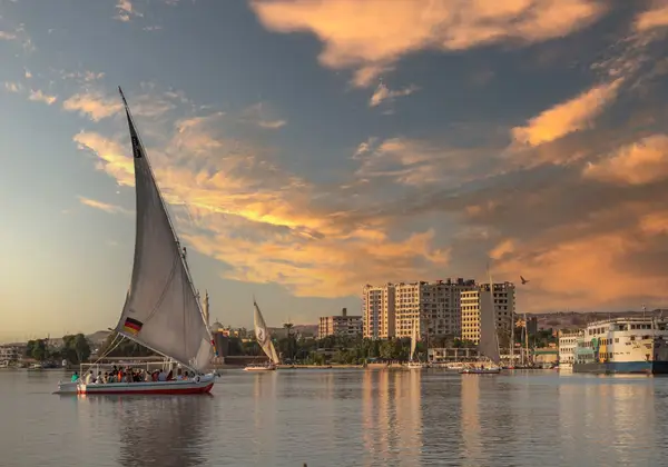 A felucca sailing the Nile at sunset