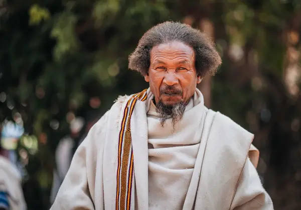 A senior Ethiopian man in a traditional robe