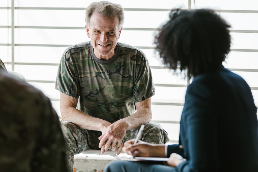 A veteran in a supportive conversation with a counselor