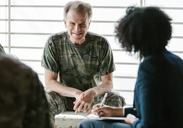 A veteran in a supportive conversation with a counselor