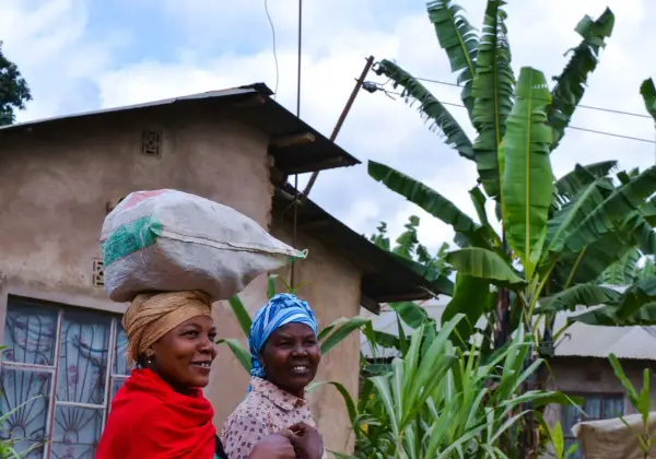 Two smiling Tanzanian women in a village in Arusha