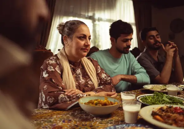A Pakistani family gathered at a meal