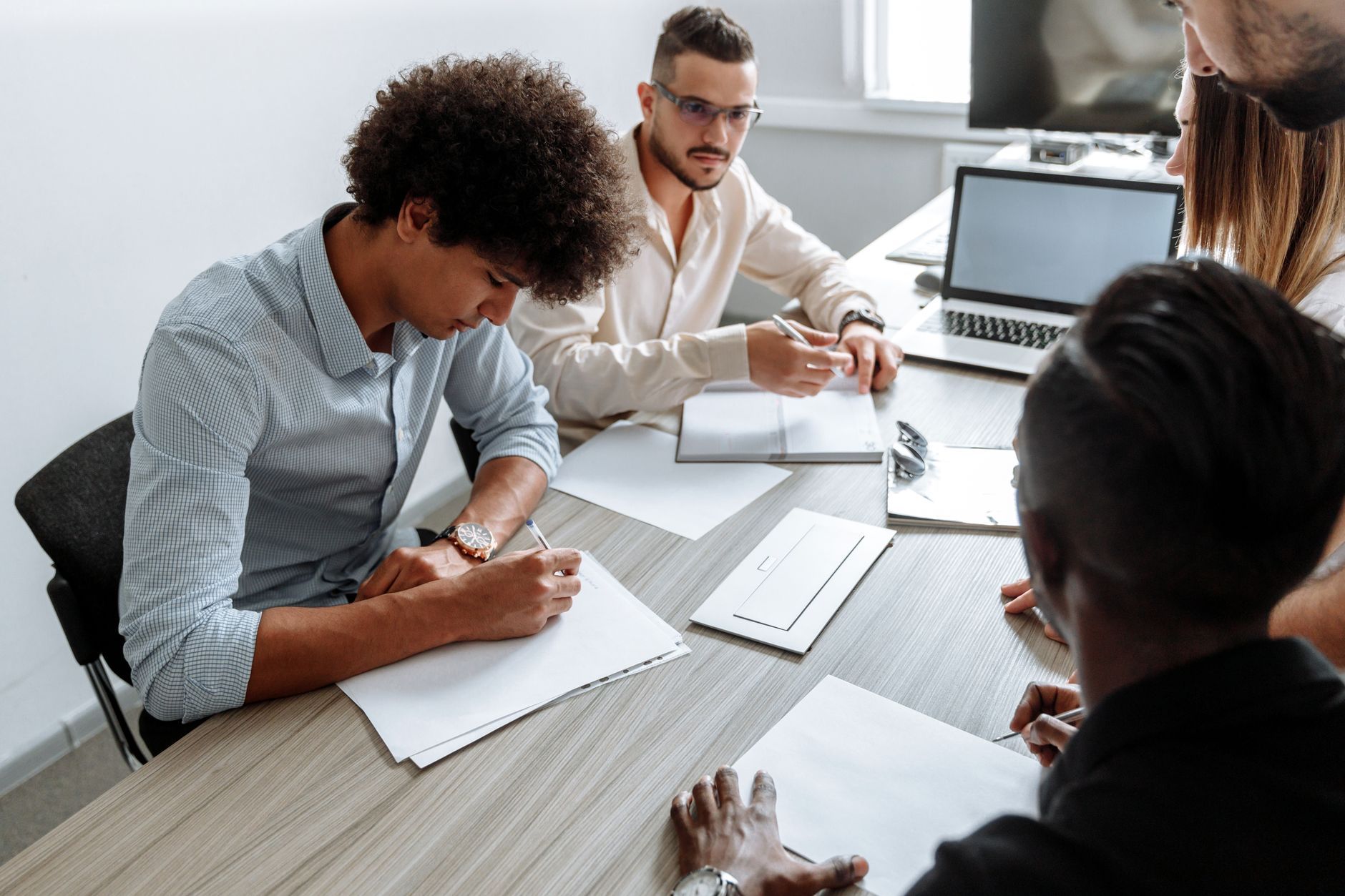A diverse team in a focused planning meeting