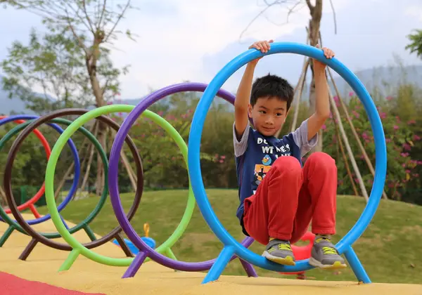 A boy playing in a park in Hong Kong
