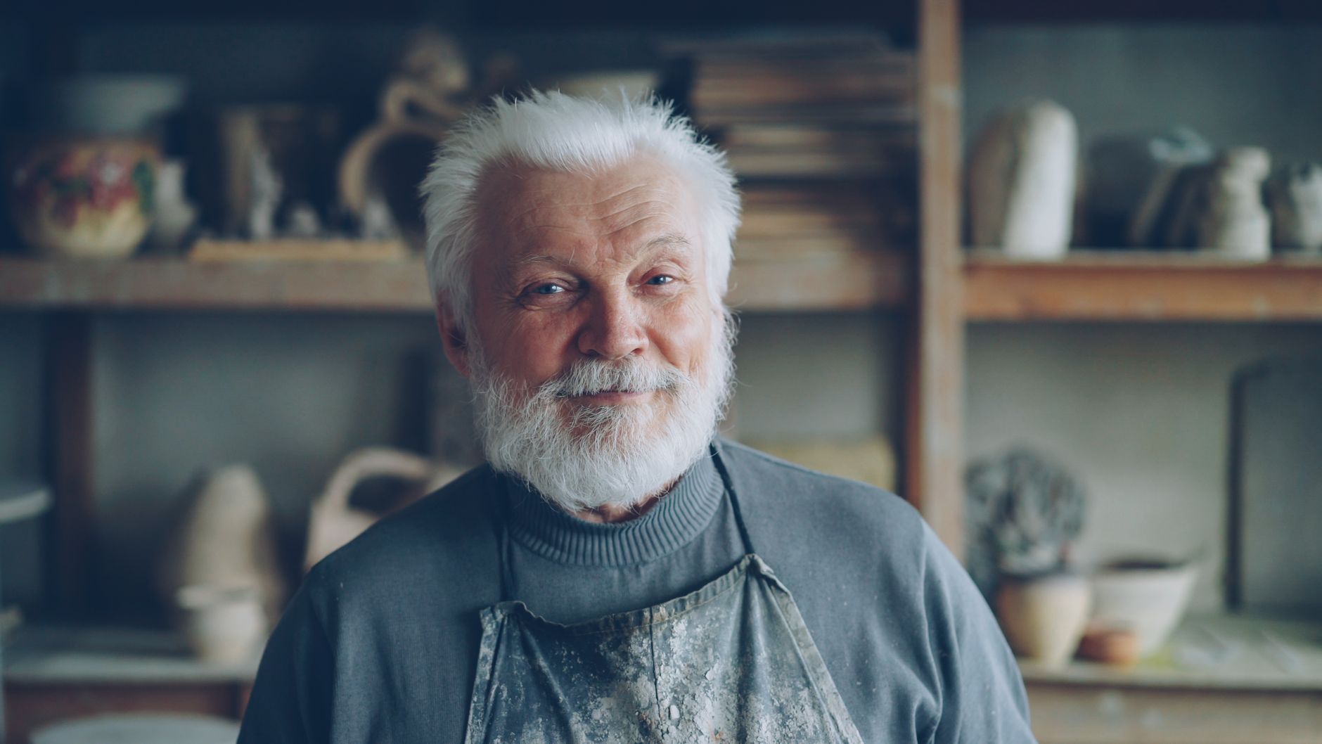 A smiling elderly German craftsman