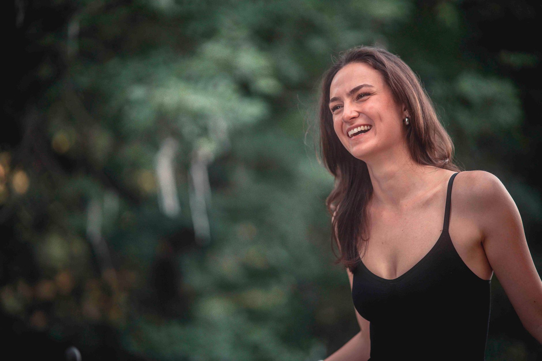 A joyful young German woman laughing