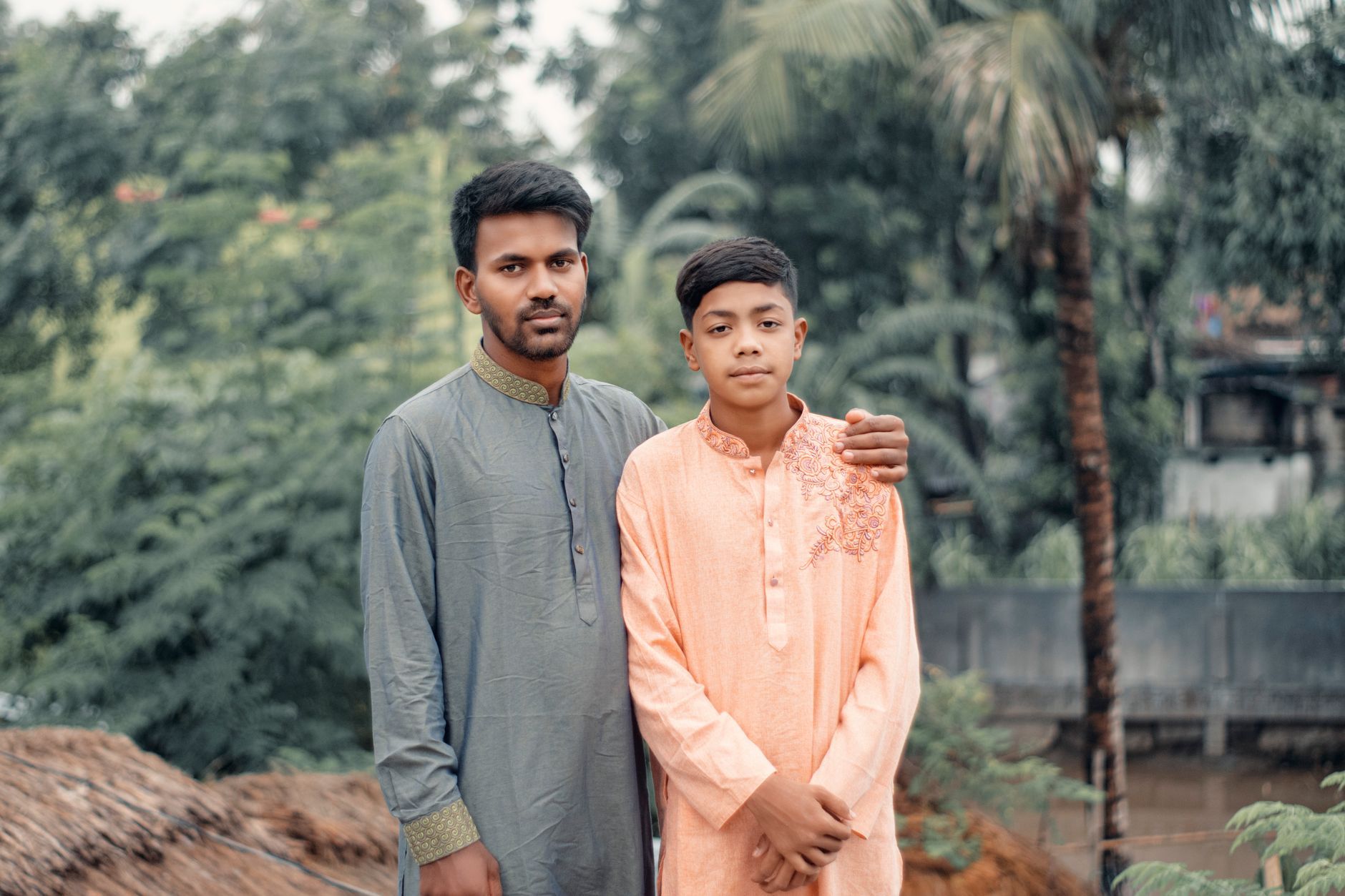 A Bangladeshi man and boy in traditional dress