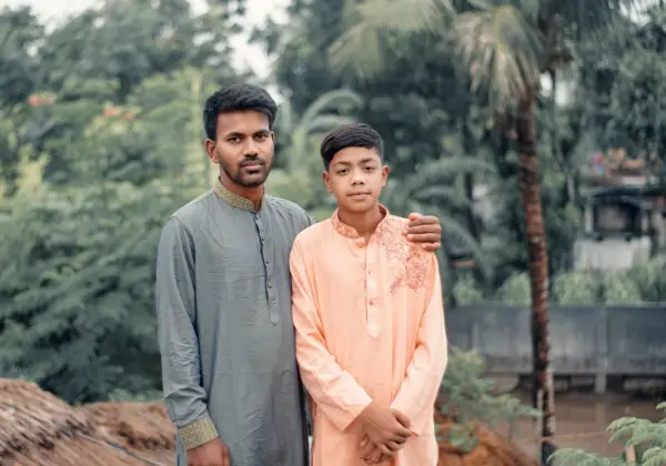 A Bangladeshi man and boy in traditional dress